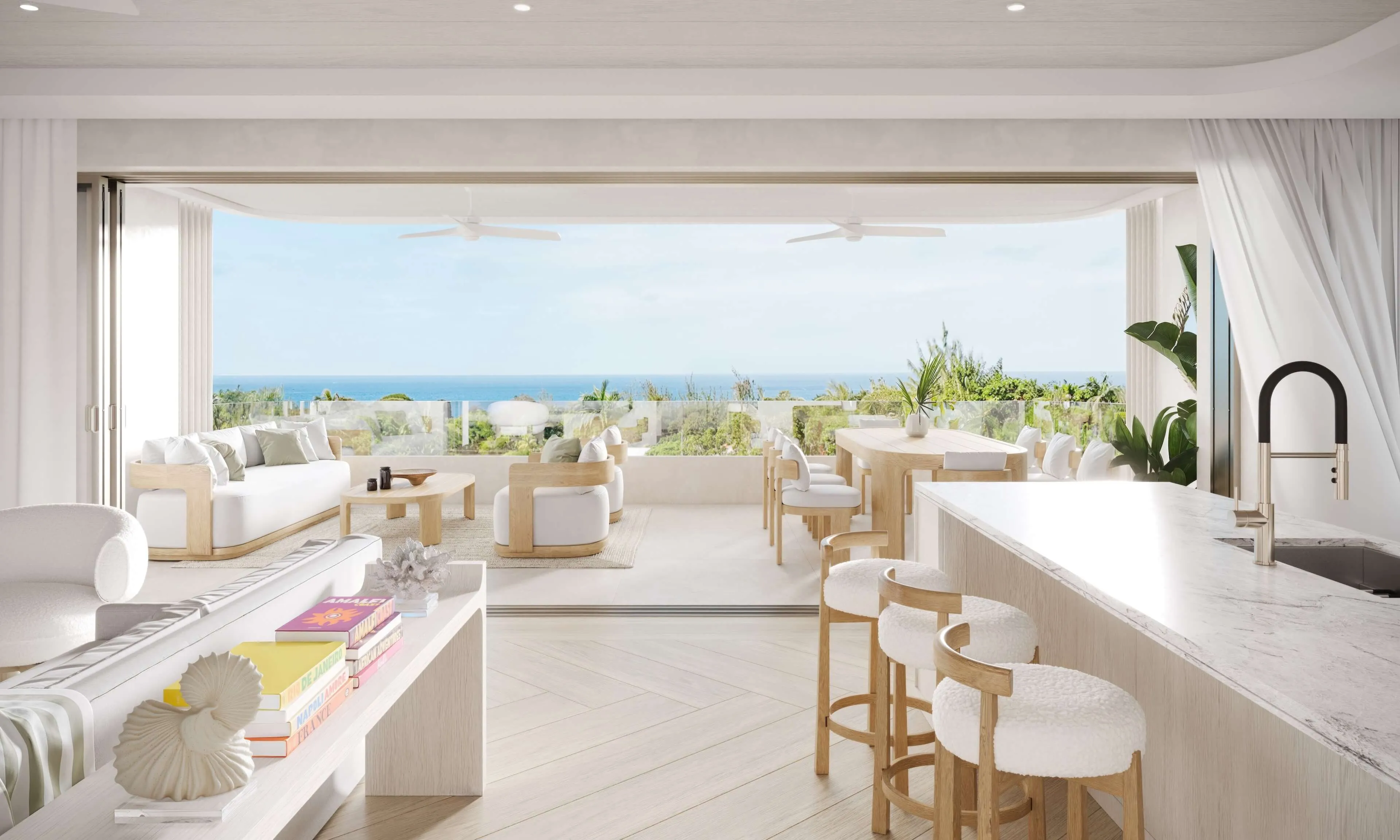Bright, modern interior with a view of the ocean, featuring dining tables, chairs, and large windows.