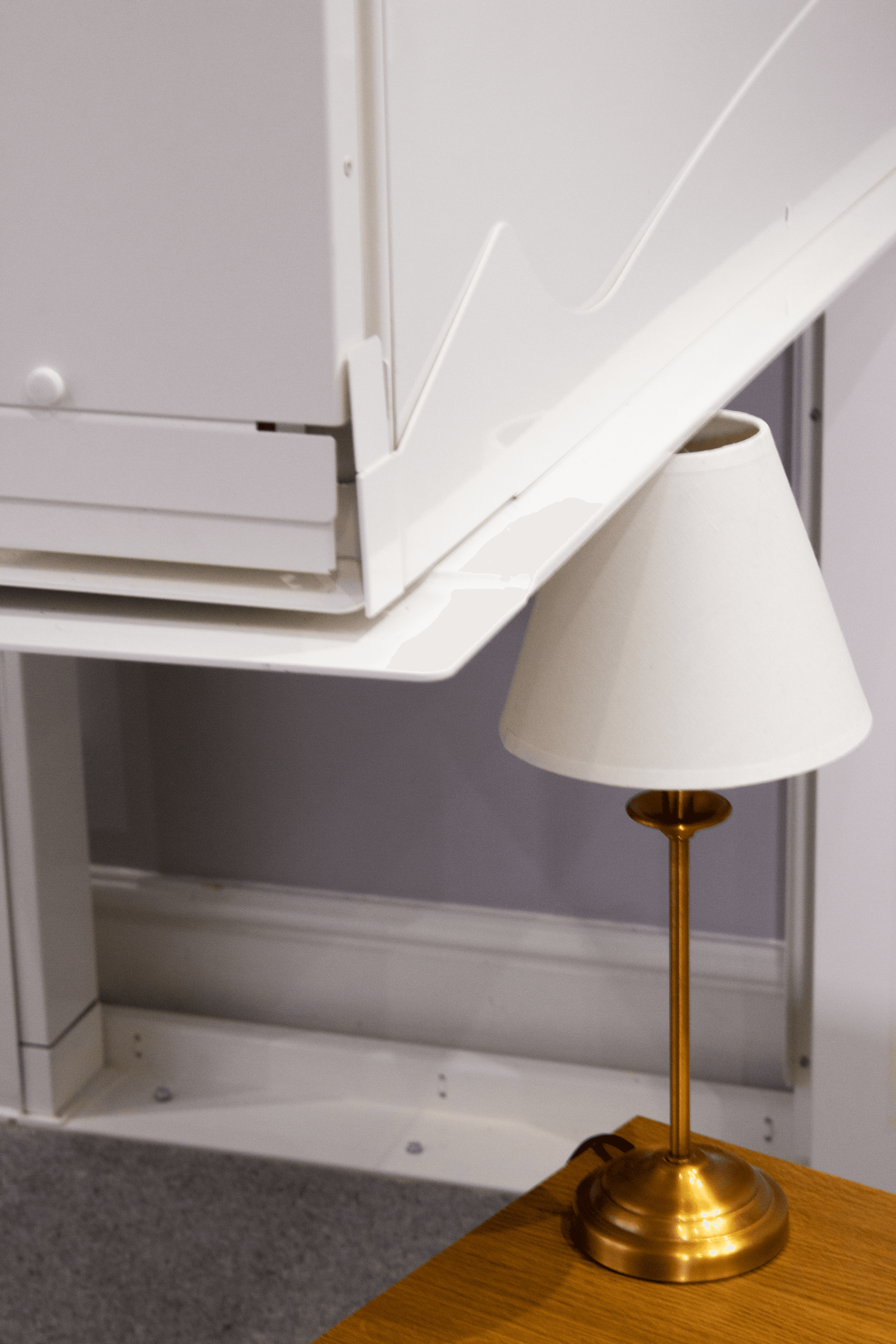Close-up of the Elevate AVA Reach through-floor homelift base at upper floor level showing the open floor aperture and white aluminium frame — illustrating the importance of keeping the area around the lift clear
