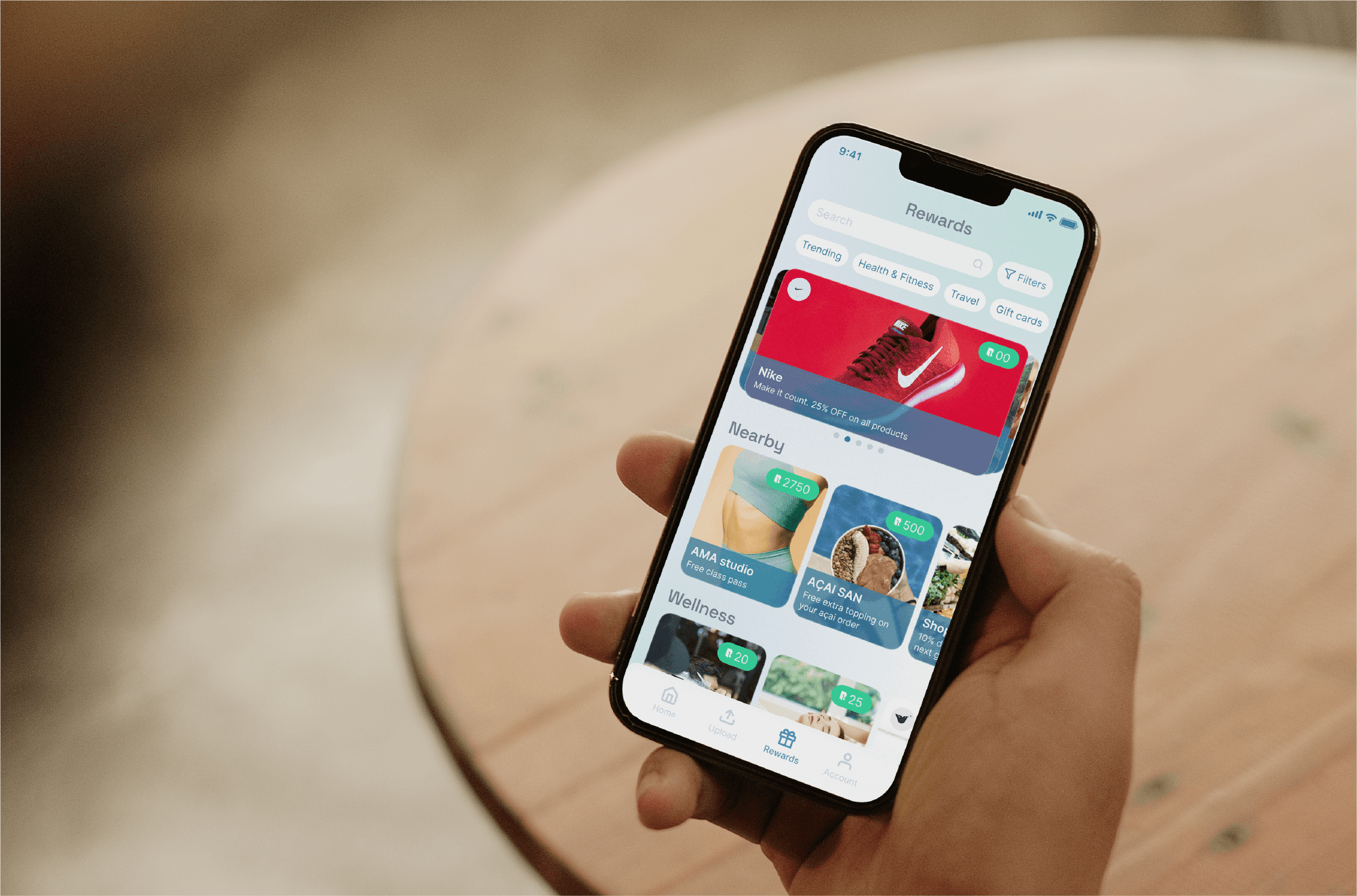 Hand holding a phone with the Rentry mobile app