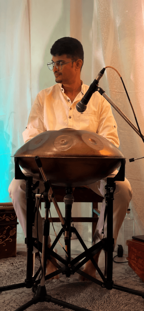 Handpan musician Sagar Belsare performing ambient handpan music during a live event in Pune