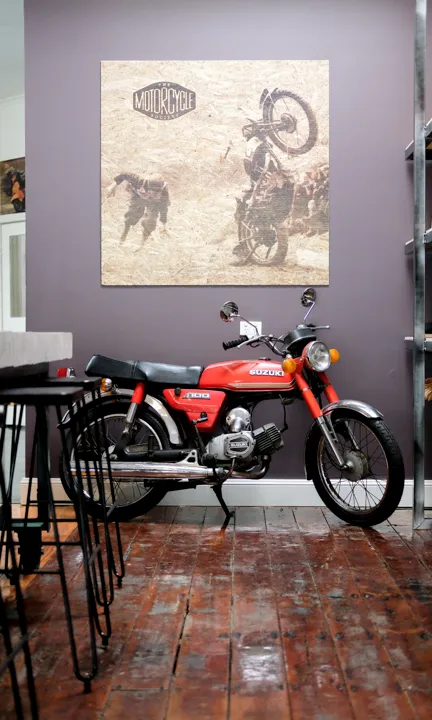 Motorcycle infront of The Motorcycle Society Poster