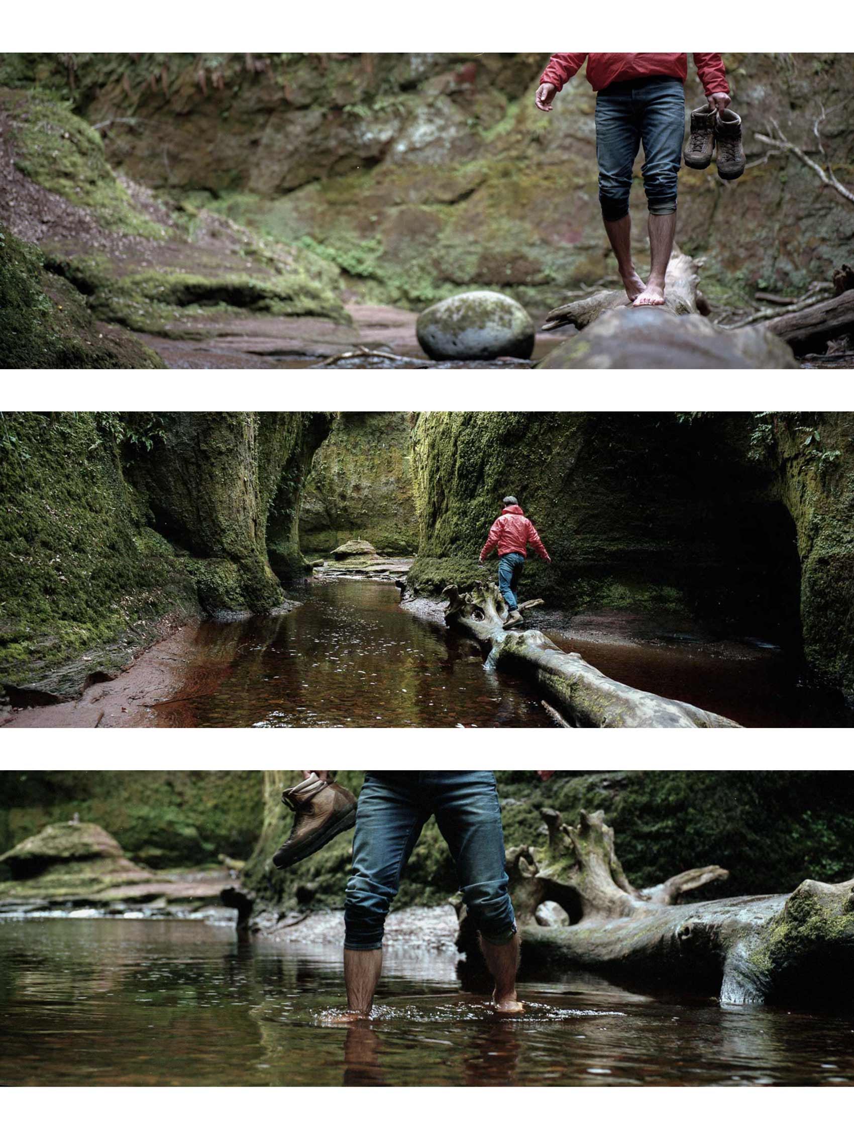 Panoramic film Gorge hike triptych wall art from Scotland, capturing a hiker walking across a tree trunk in the gorge that is filled with water on the Hasselblad Xpan
