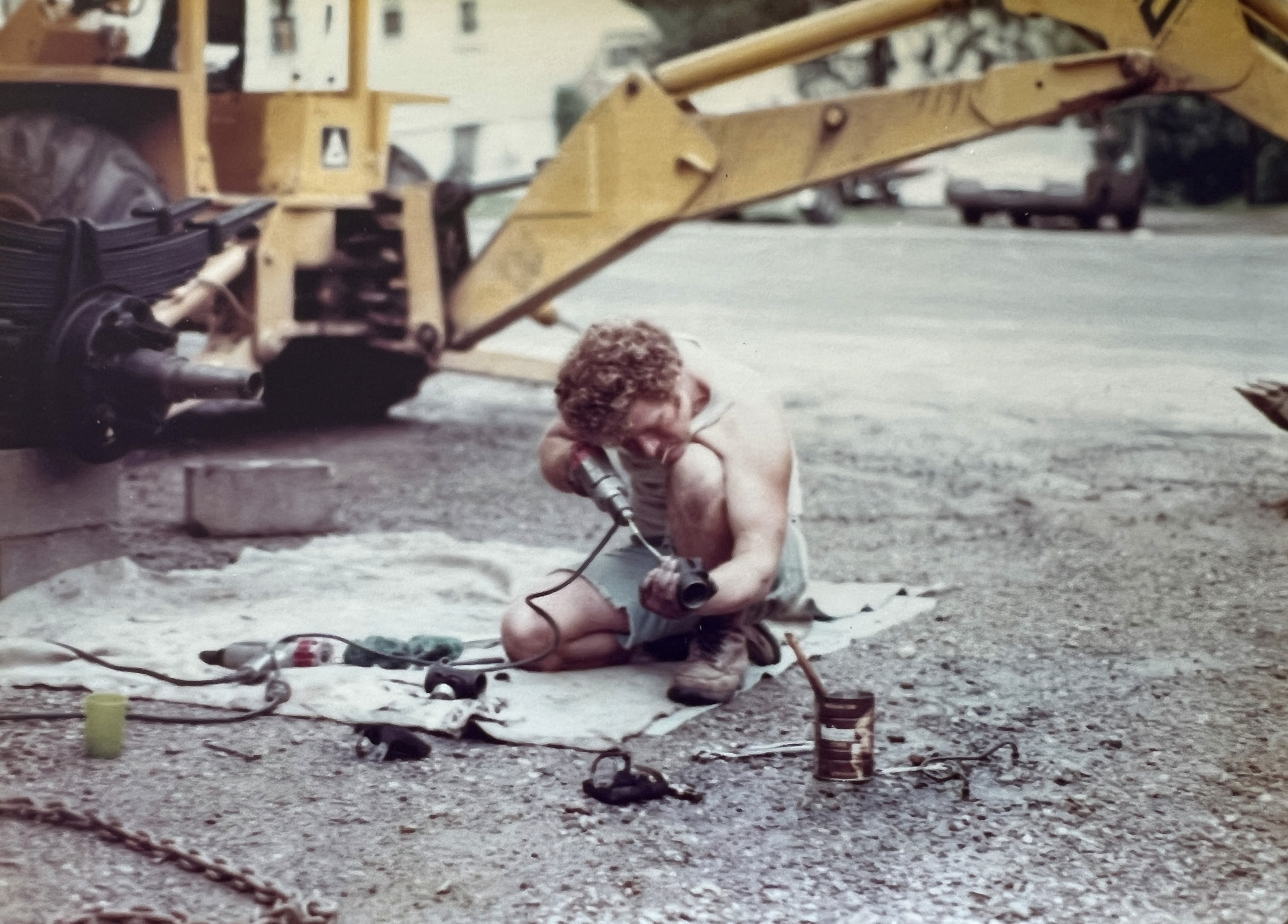 Casali Companies founder operating a backhoe while performing site excavation work in the early days of the company