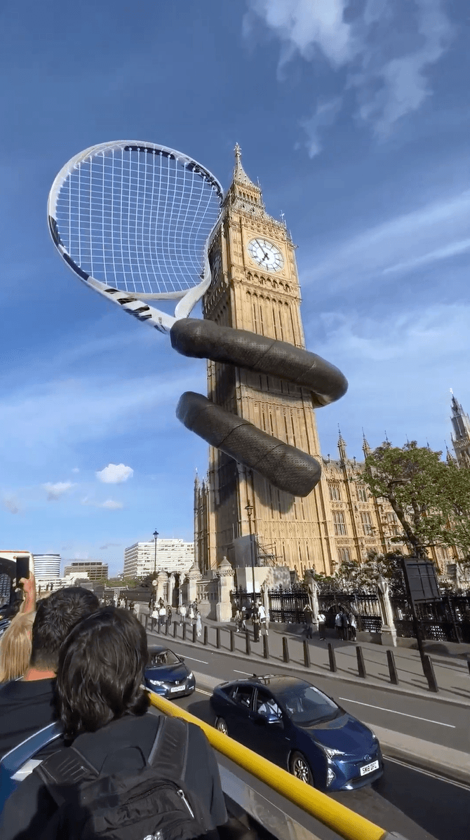 A massive tennis racket wrapped around Big Ben in a mixed reality city scene