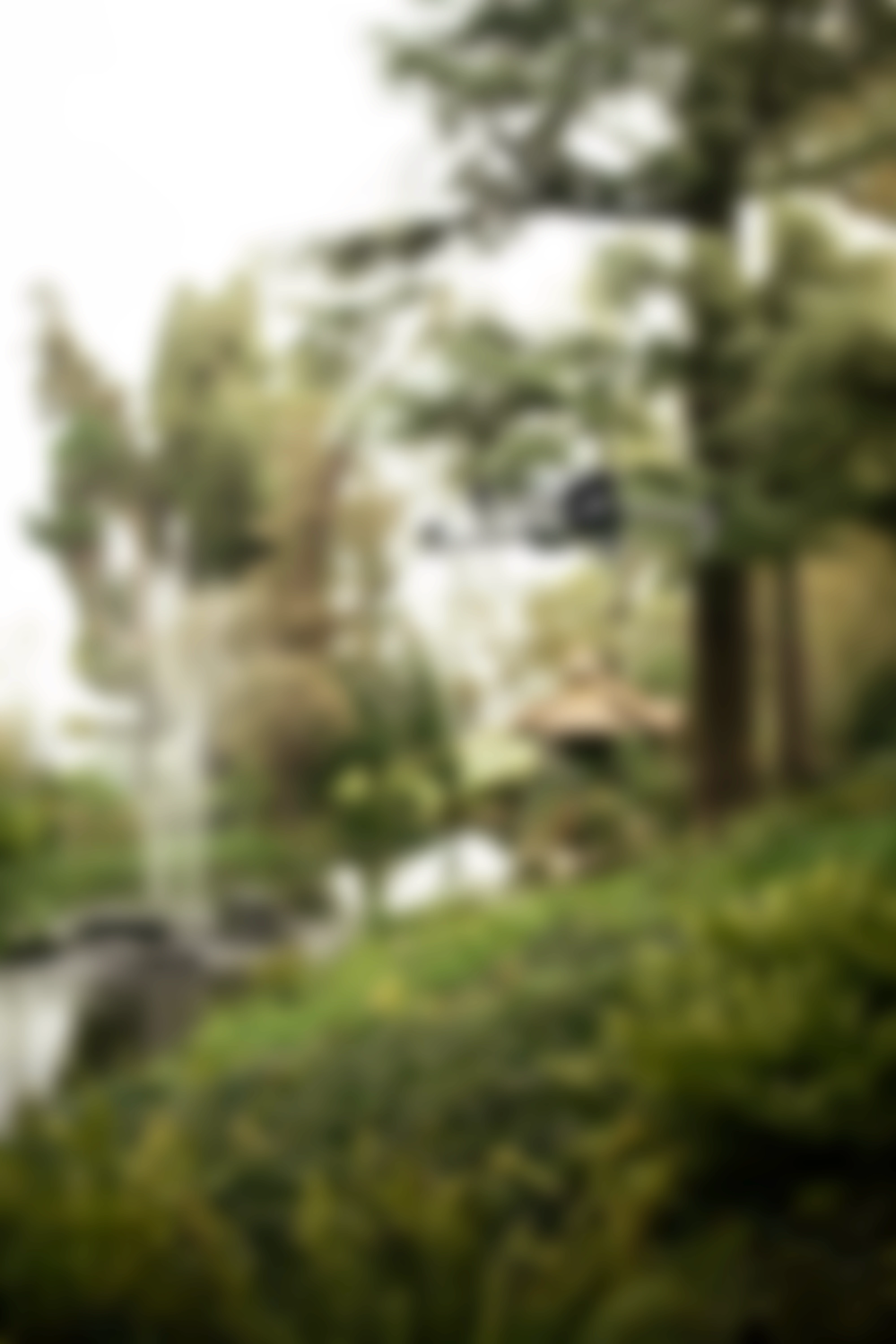 A modern digital alarm clock with orange accents, slight blur, displaying 7:08.