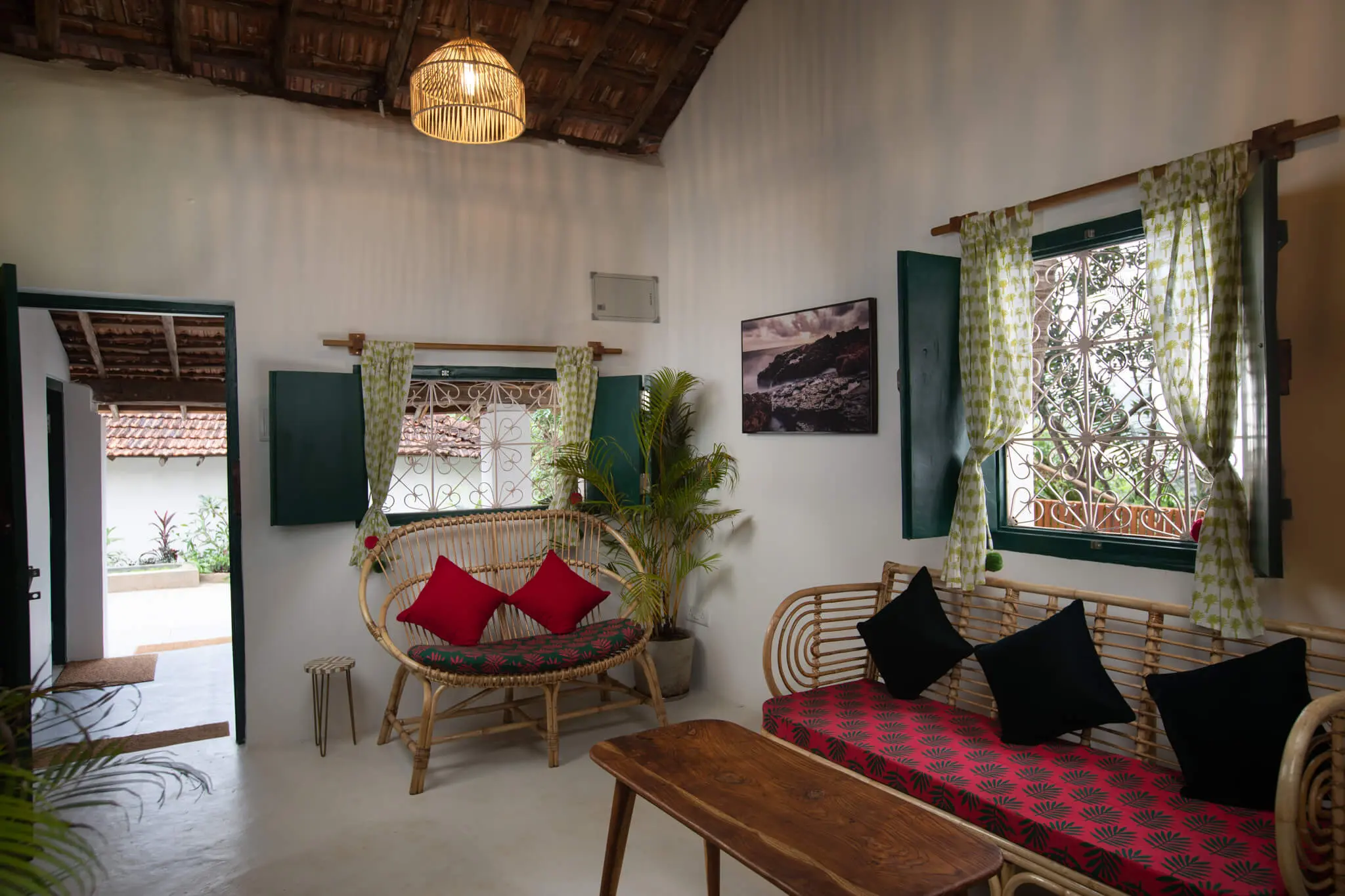 Heritage Seaside Cottage at Casa Jaali — cane-furnished sitting room