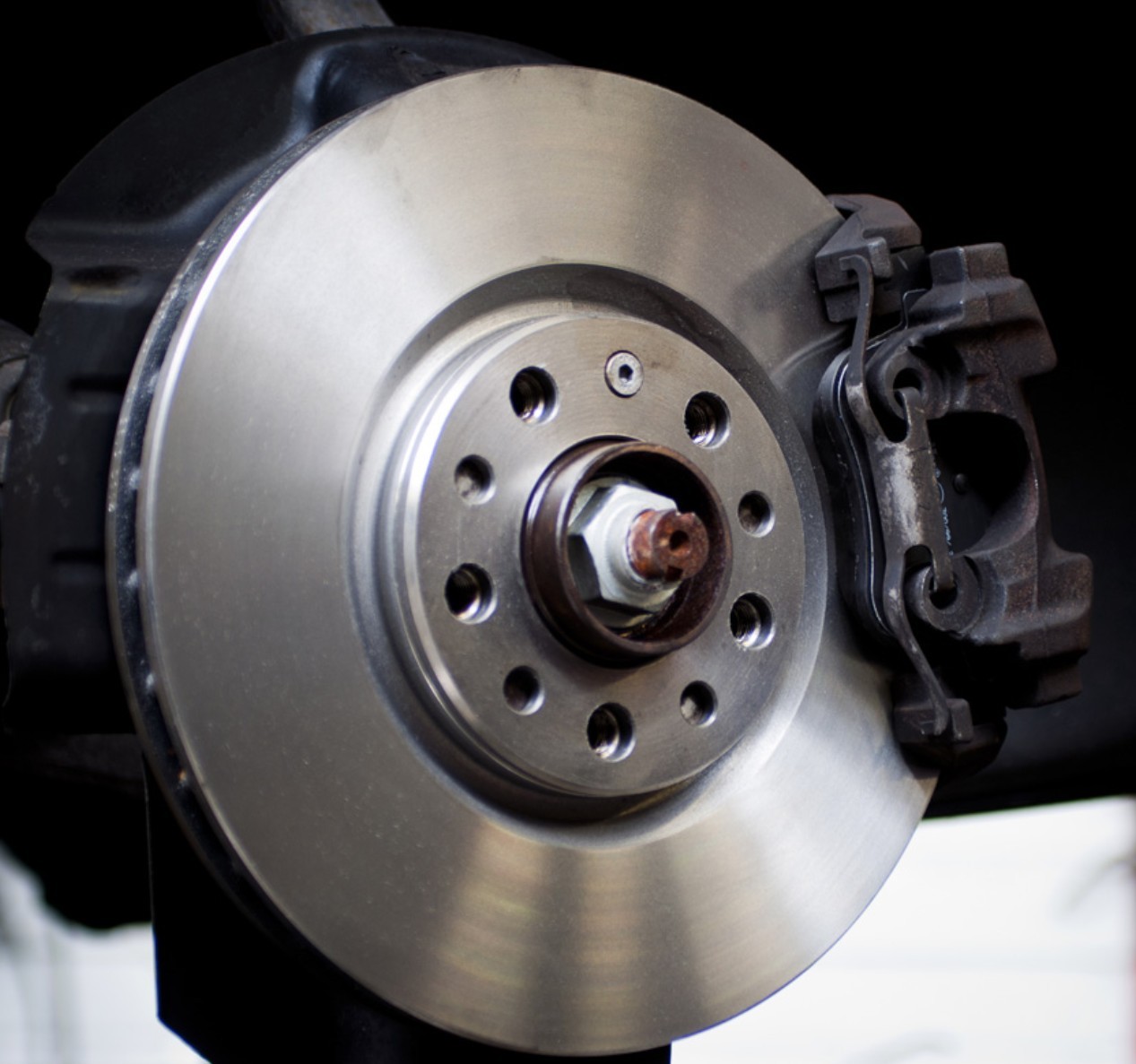 Close-up inspection of vehicle brake and suspension components