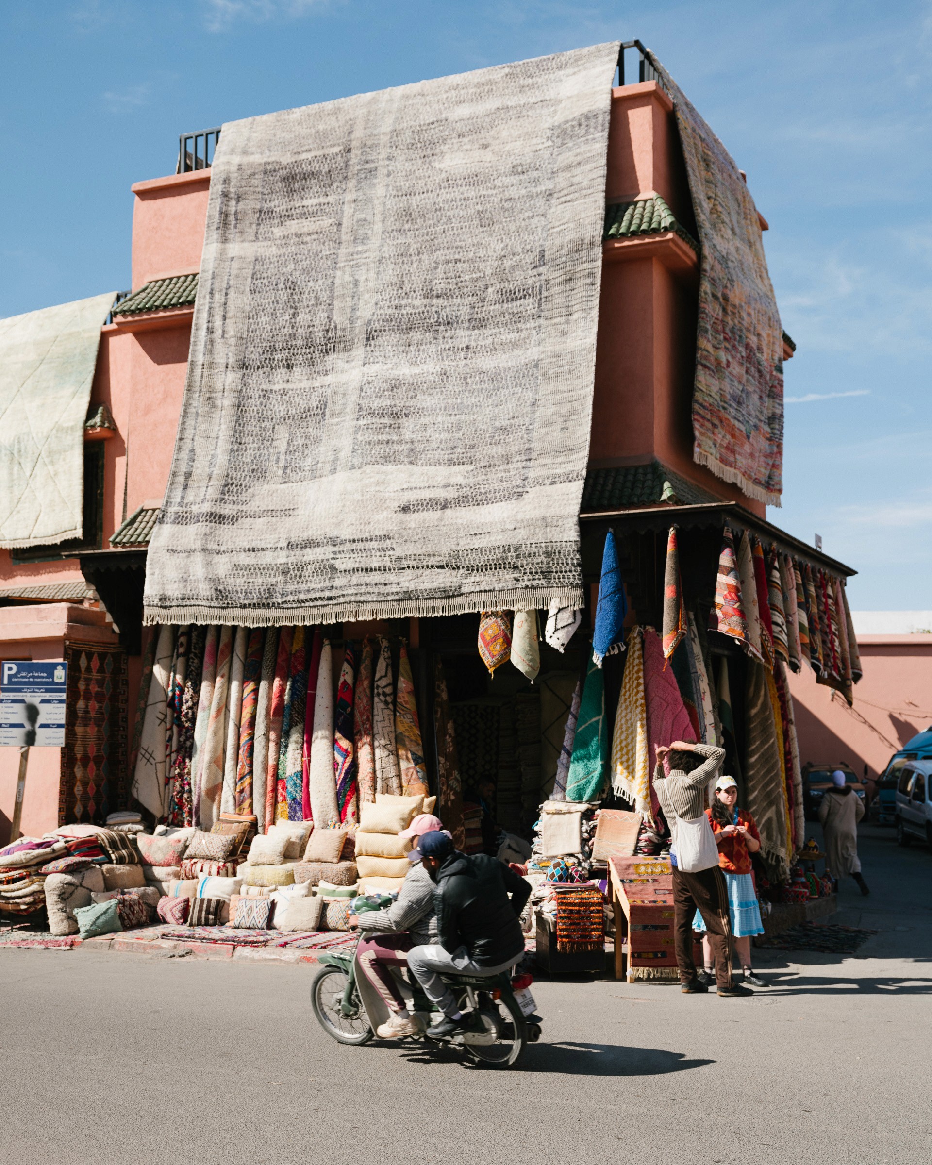 Streetside billboard with flyposters of the Batch.Works brand and illustrations
