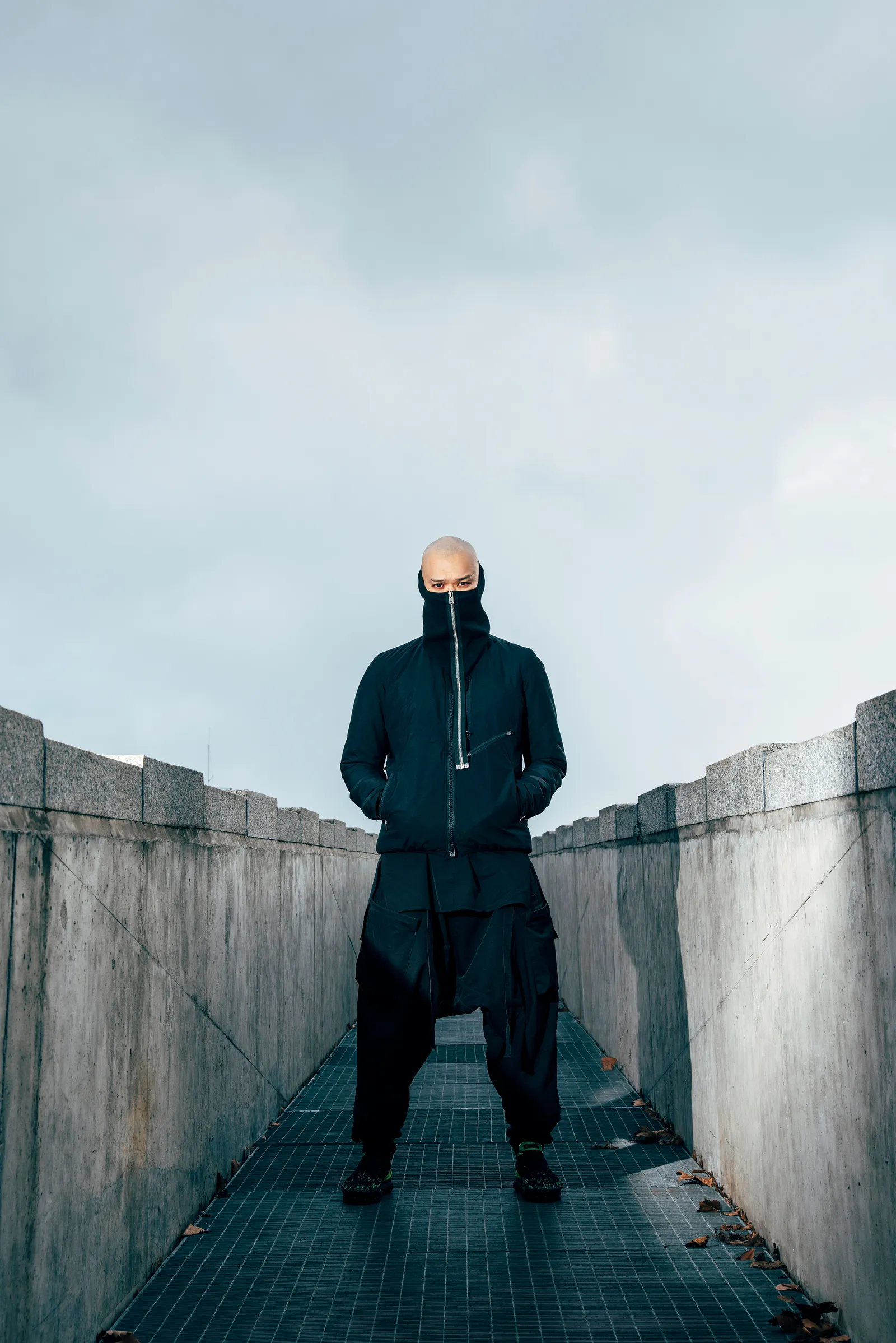 A fluffy gray rabbit rests on a floral chair.