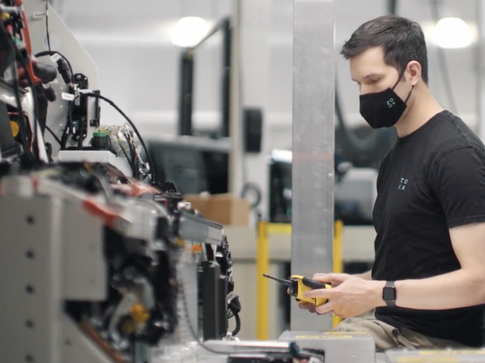 man using fort wireless remote controller testing autonomous vehicle