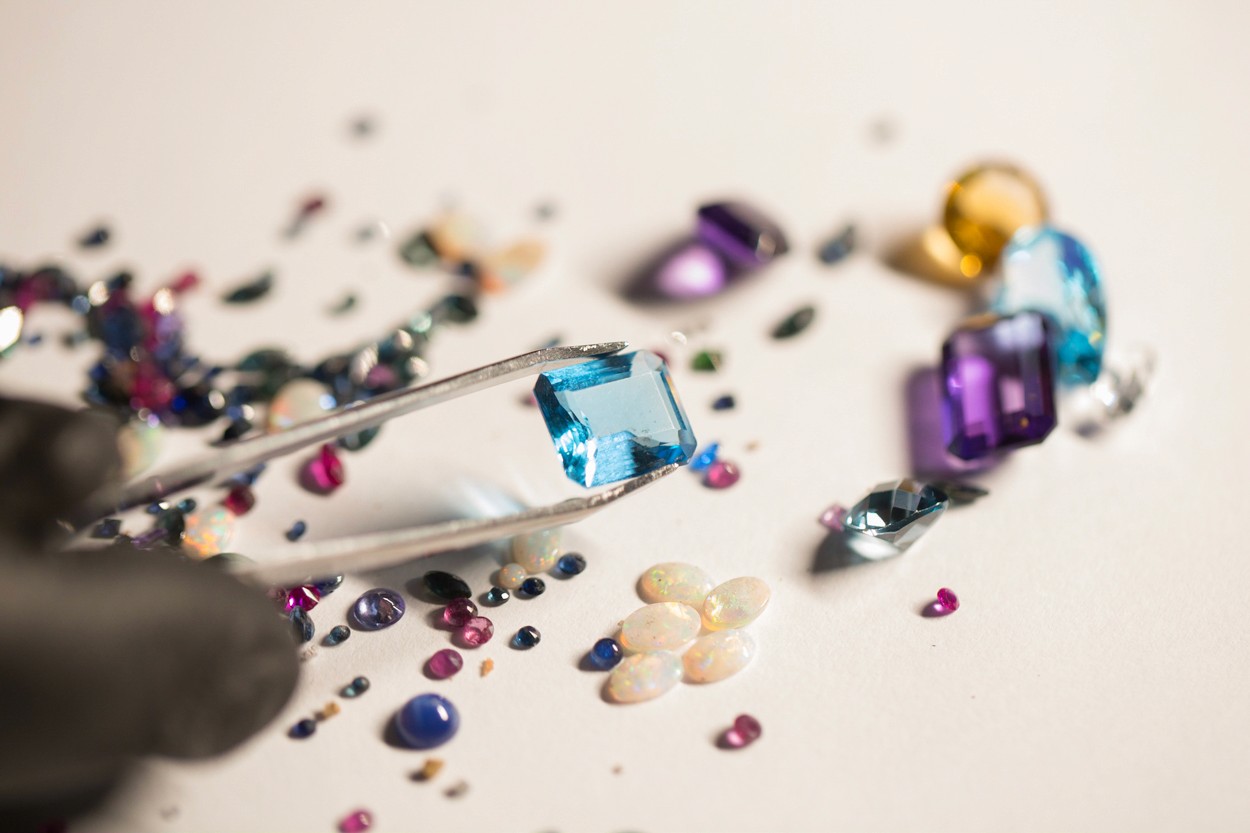 Loose gemstones and diamonds extracted from jewelry scrap during the stone recovery process.