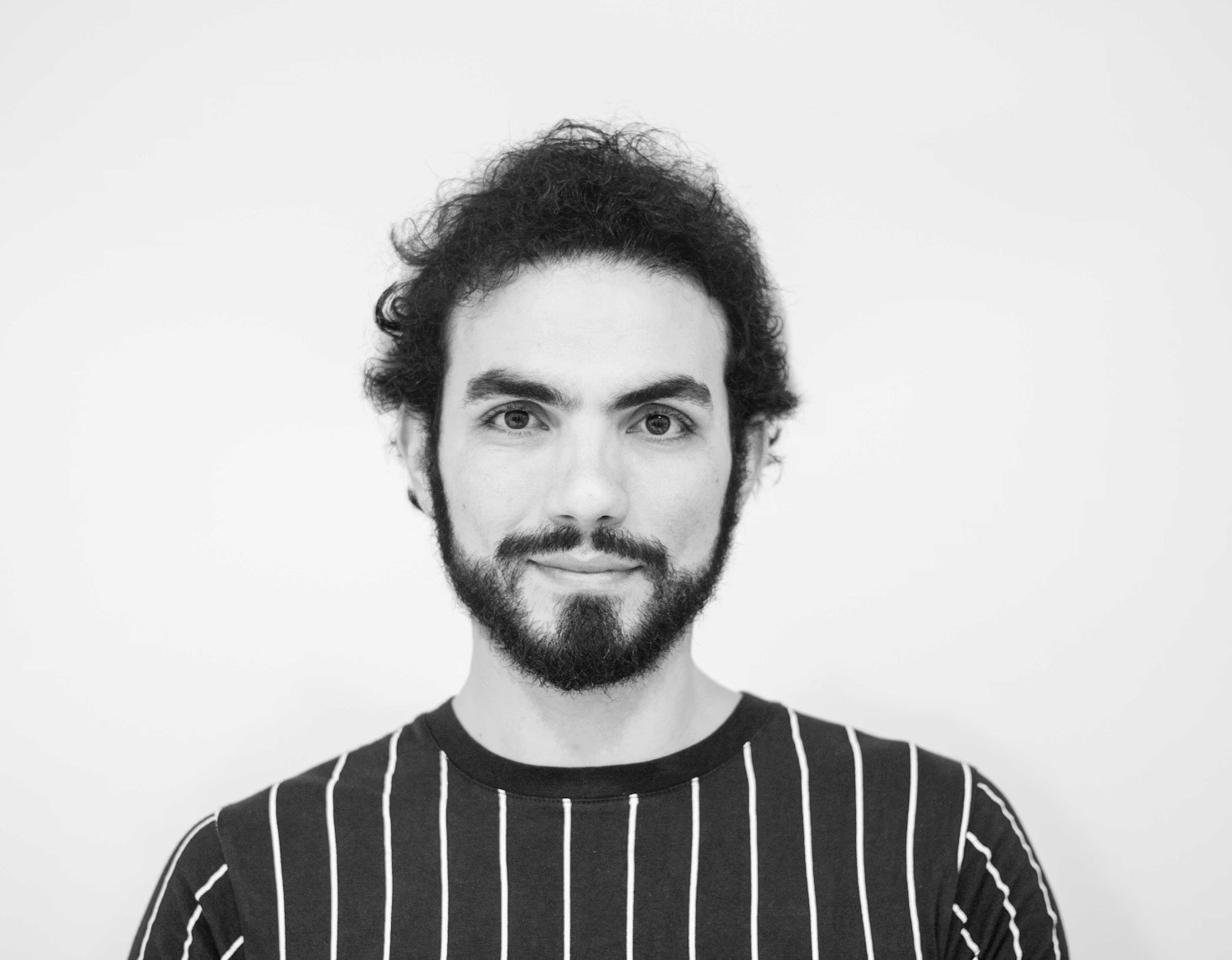 a notebook with a pen on top of a wooden table