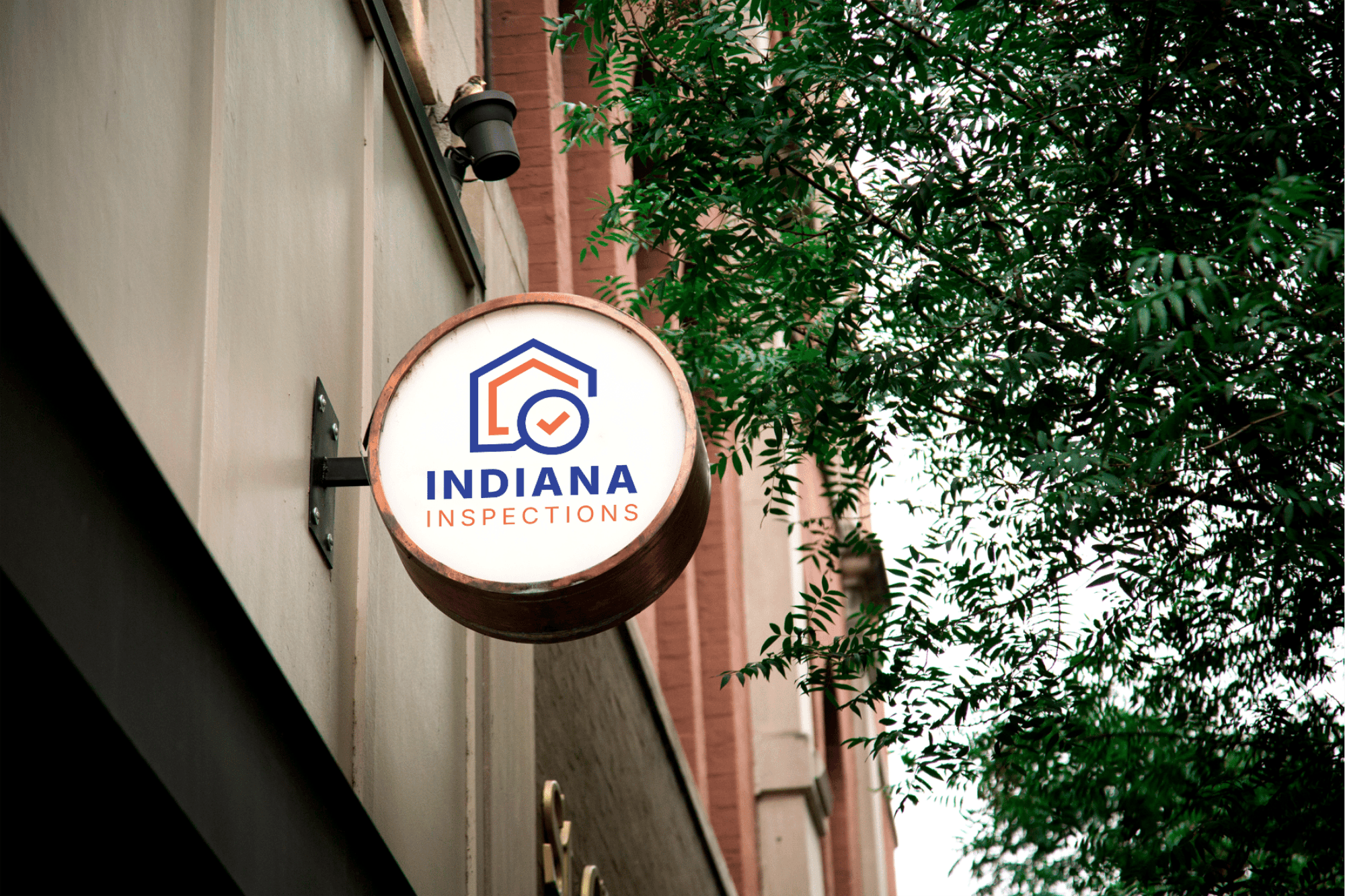 Indiana Inspections storefront sign mounted on a building exterior