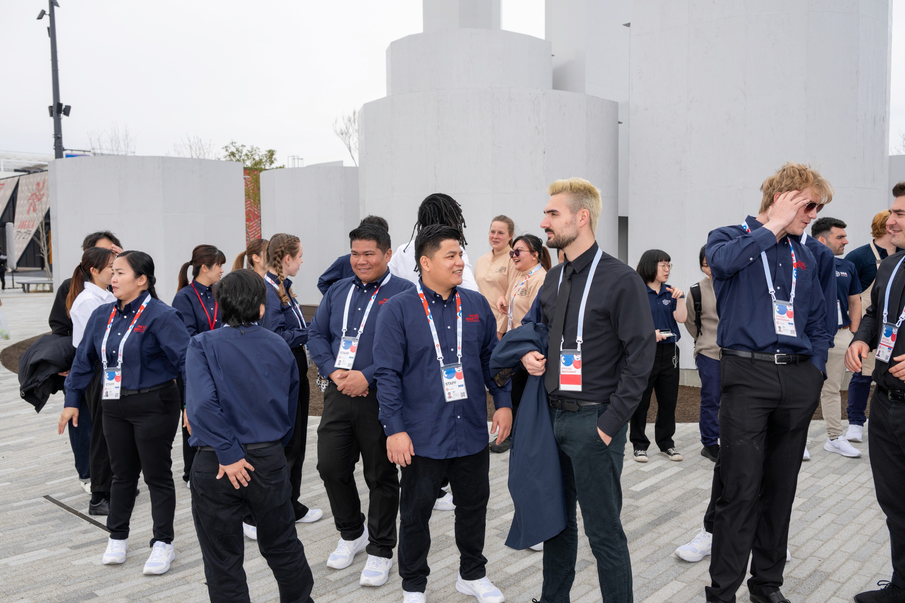 a table topped with plates of food next to a tray of food