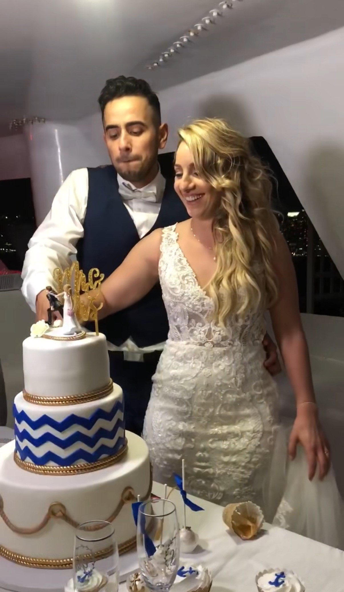 selective focus photo of man standing holding DSLR camera