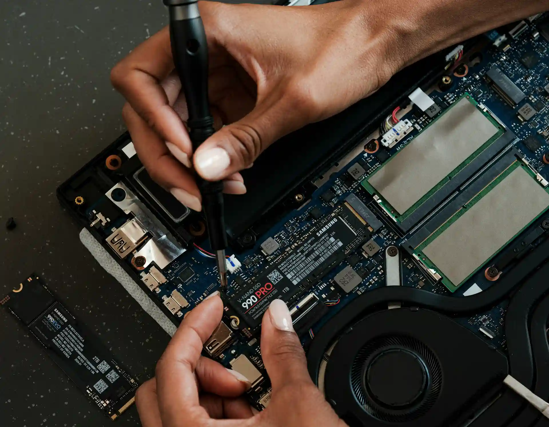 black hands reparing electronics