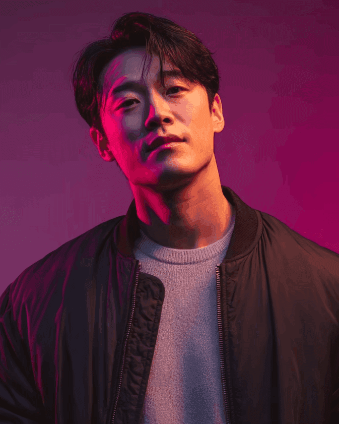 Young man portrait with dramatic purple and pink lighting