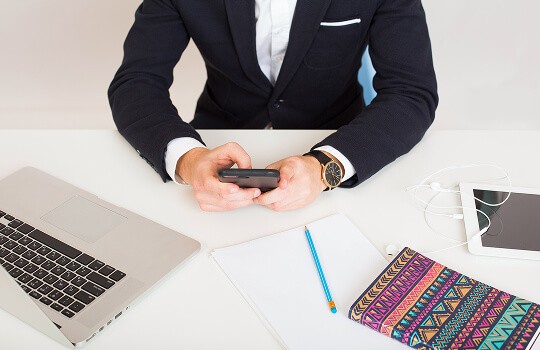 man writing documents in the office