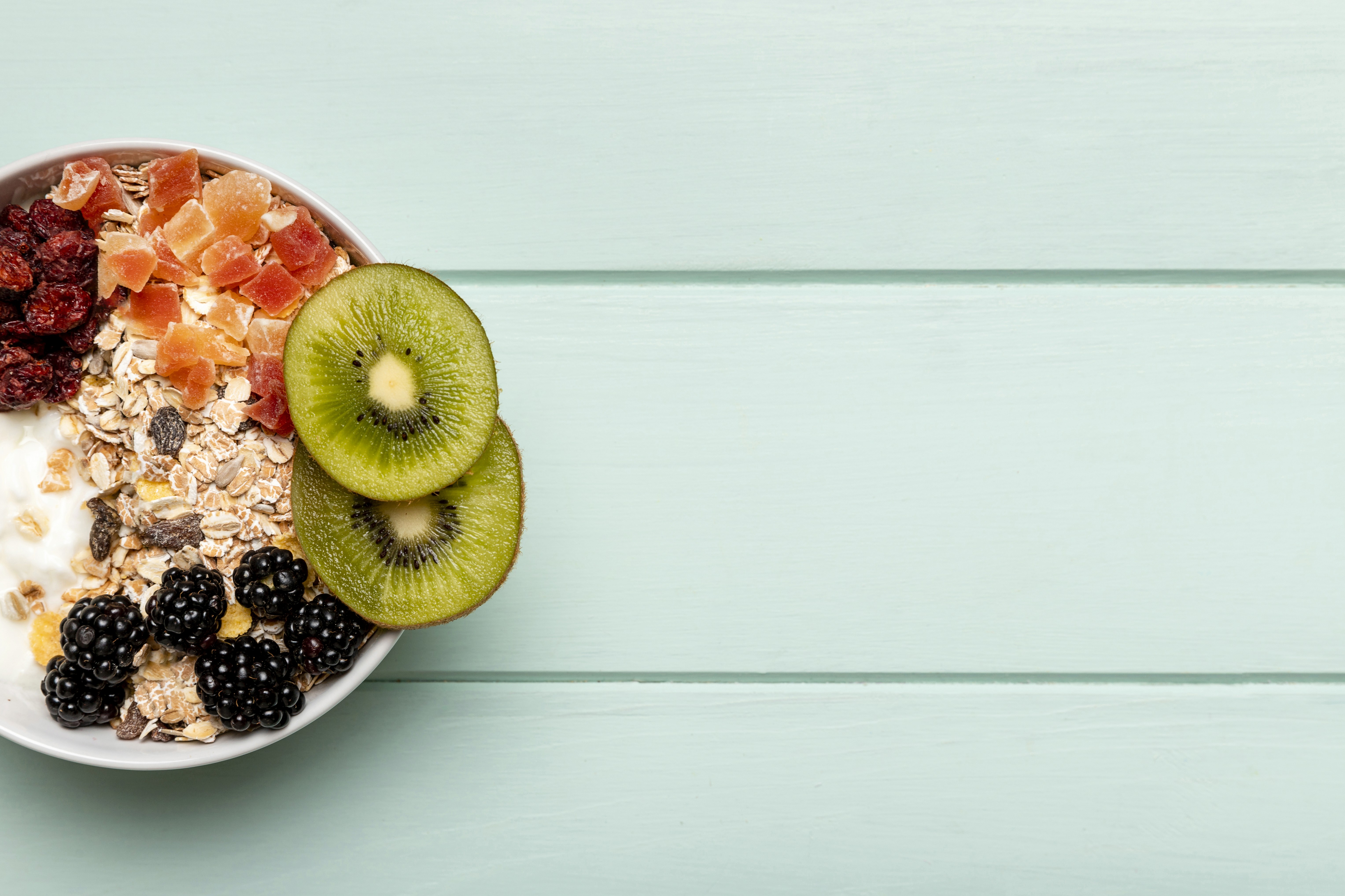 Assortment of healthy foods with a nutrition analysis display, showcasing comprehensive nutrition tracking by Caloric