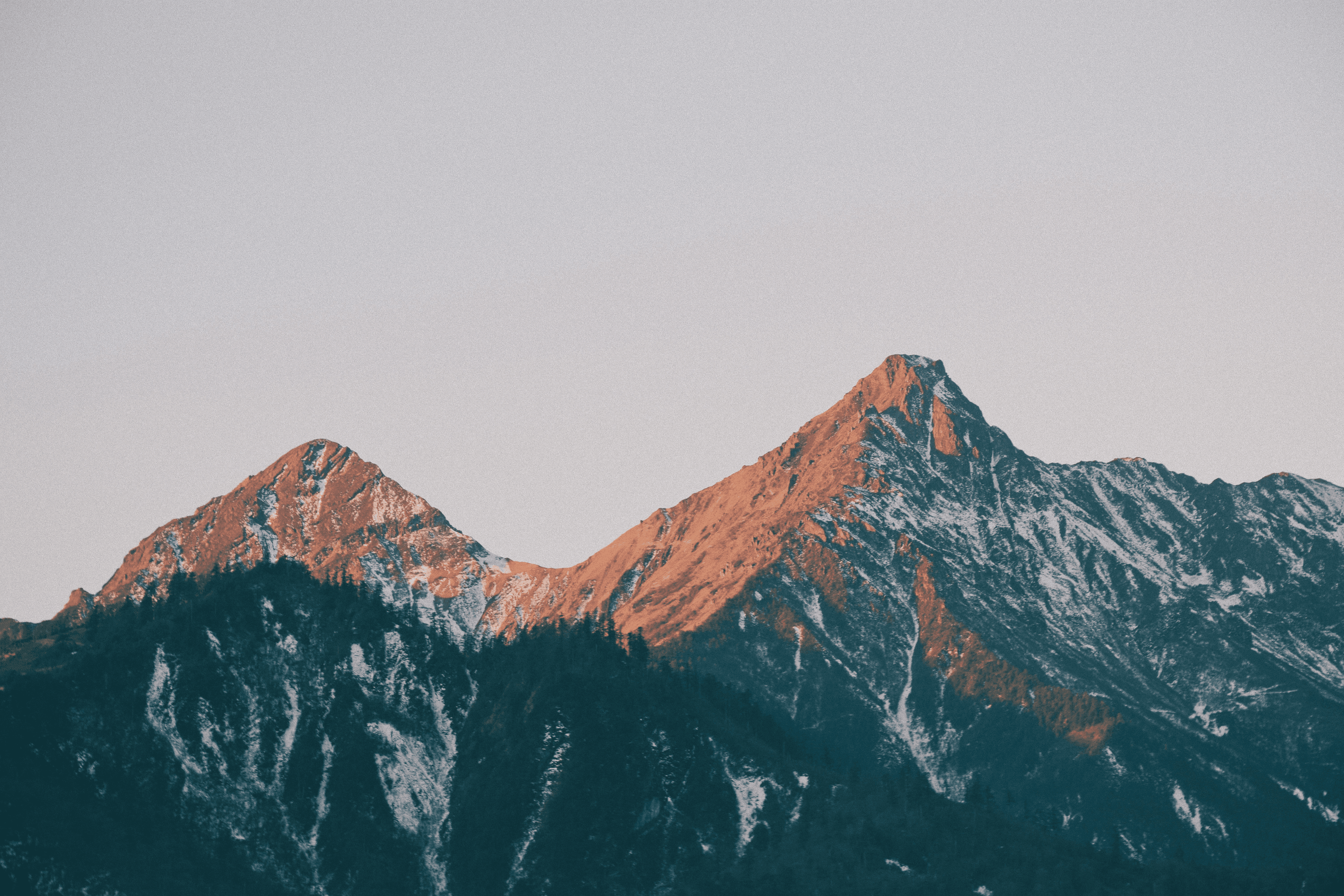 brown-mountains-under-white-sky - jerry-zhang (unsplash)./pho