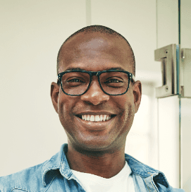 Smiling Nigerian man representing trust, transparency, and verified digital confidence with Profiled Nigeria