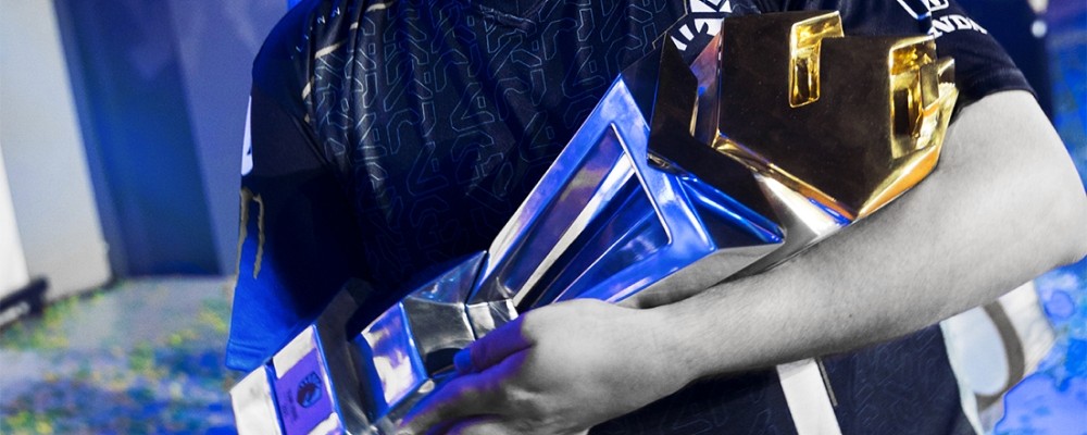 A Team Liquid player holding a RainbowSix trophy