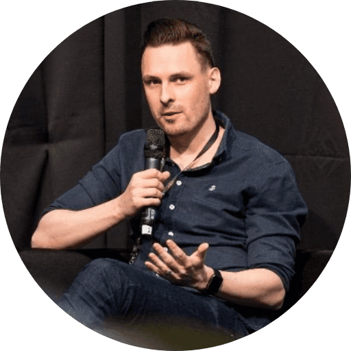 A person on a cozy studio smiling