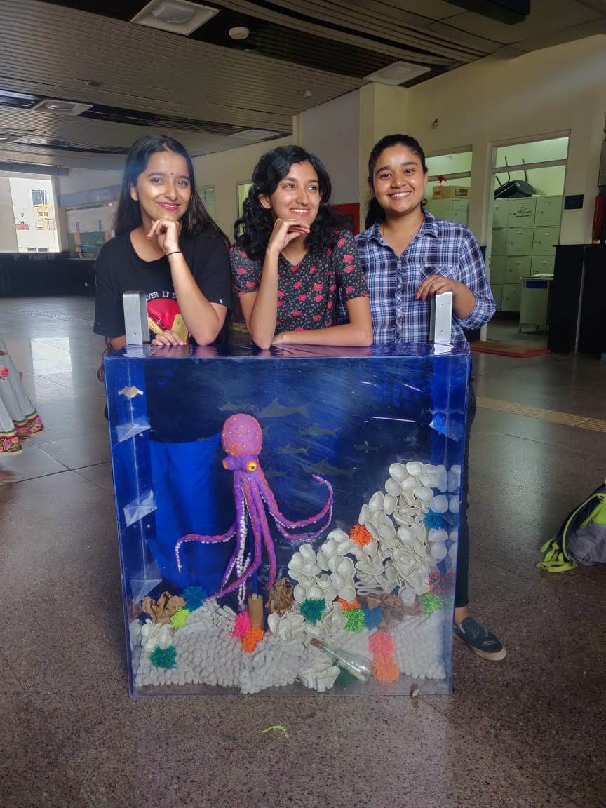 people in a large building with Tate Modern in the background