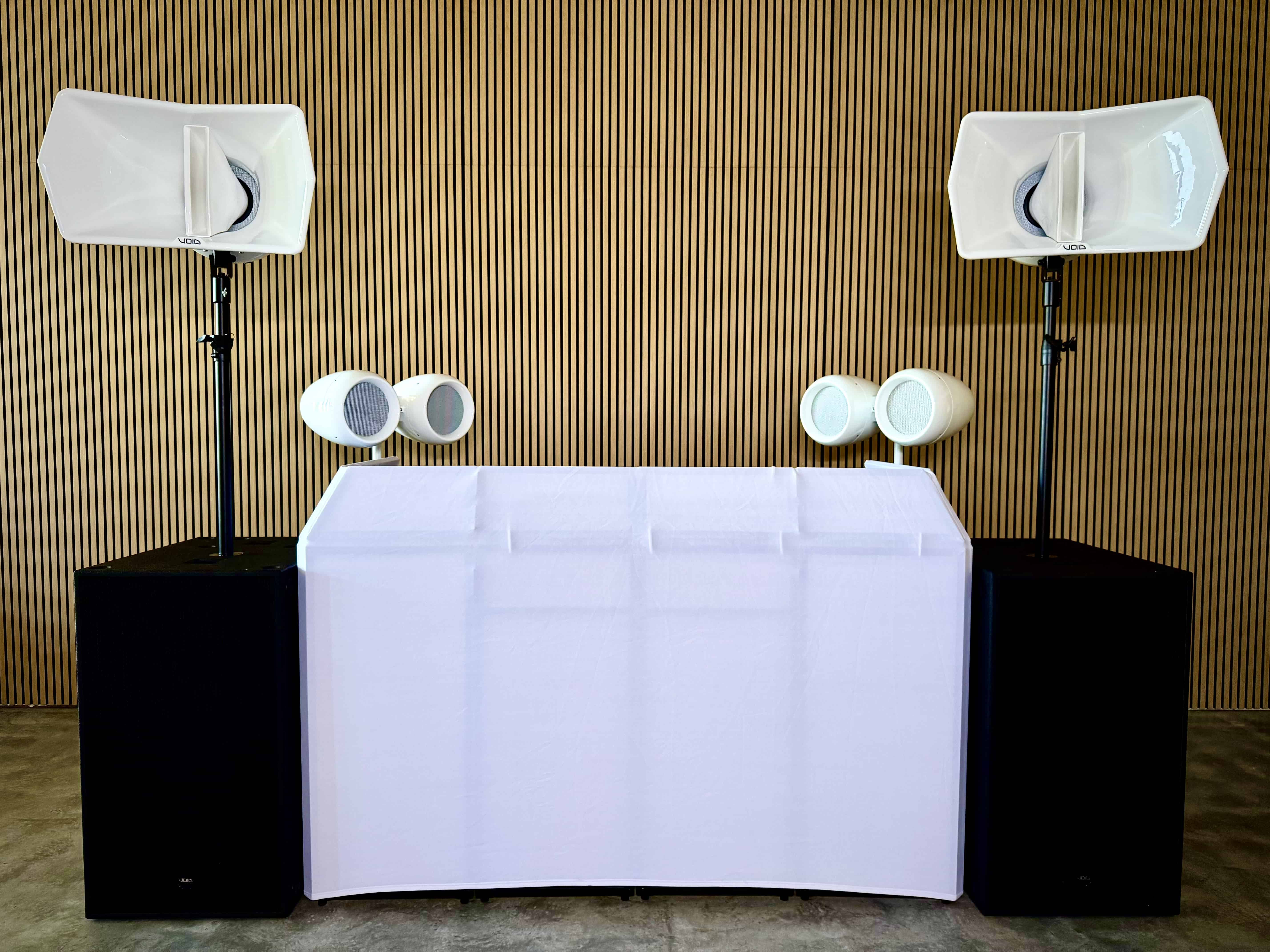 a group of people standing in front of a stage