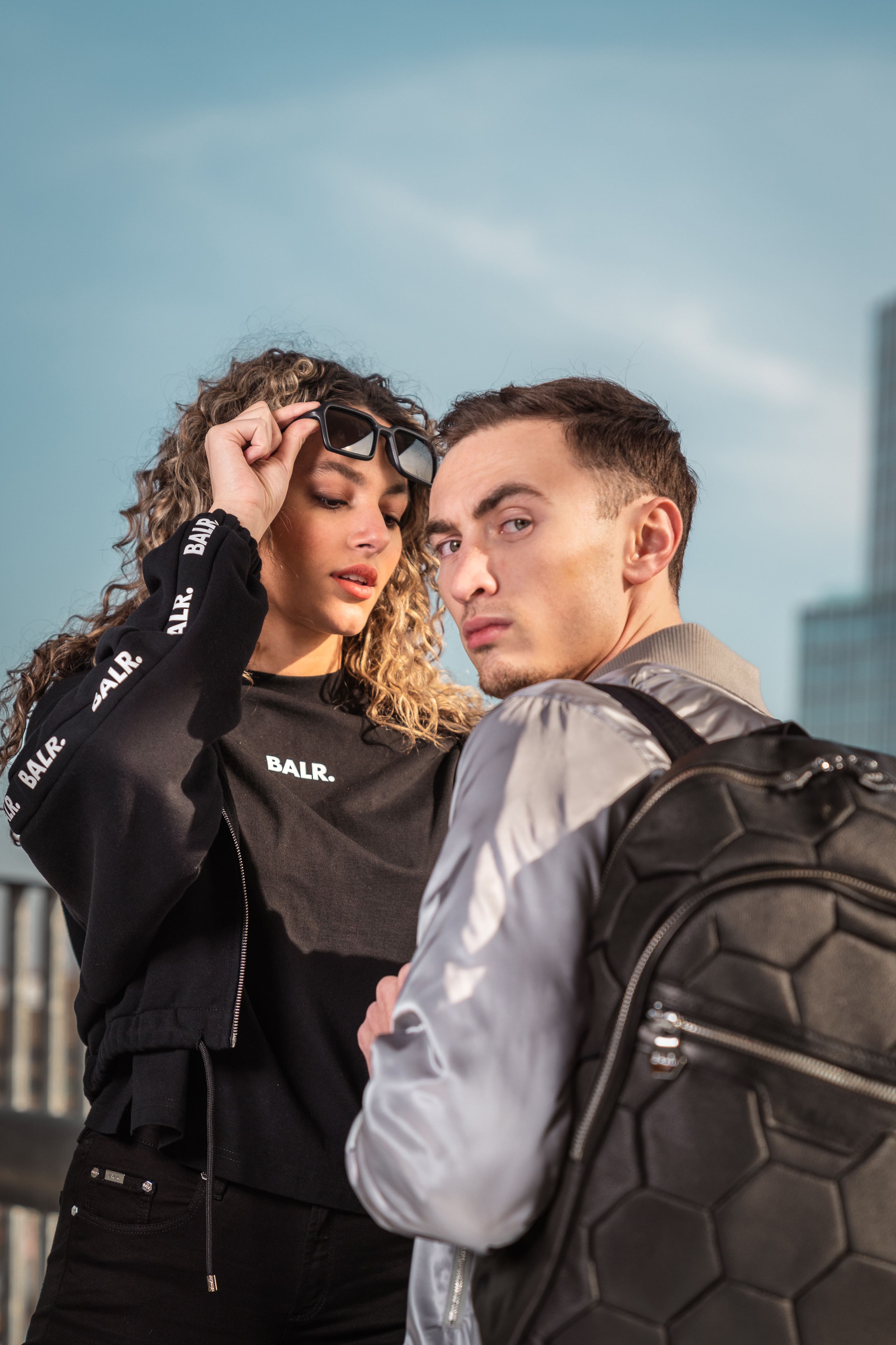 Streetside billboard with flyposters of the Batch.Works brand and illustrations