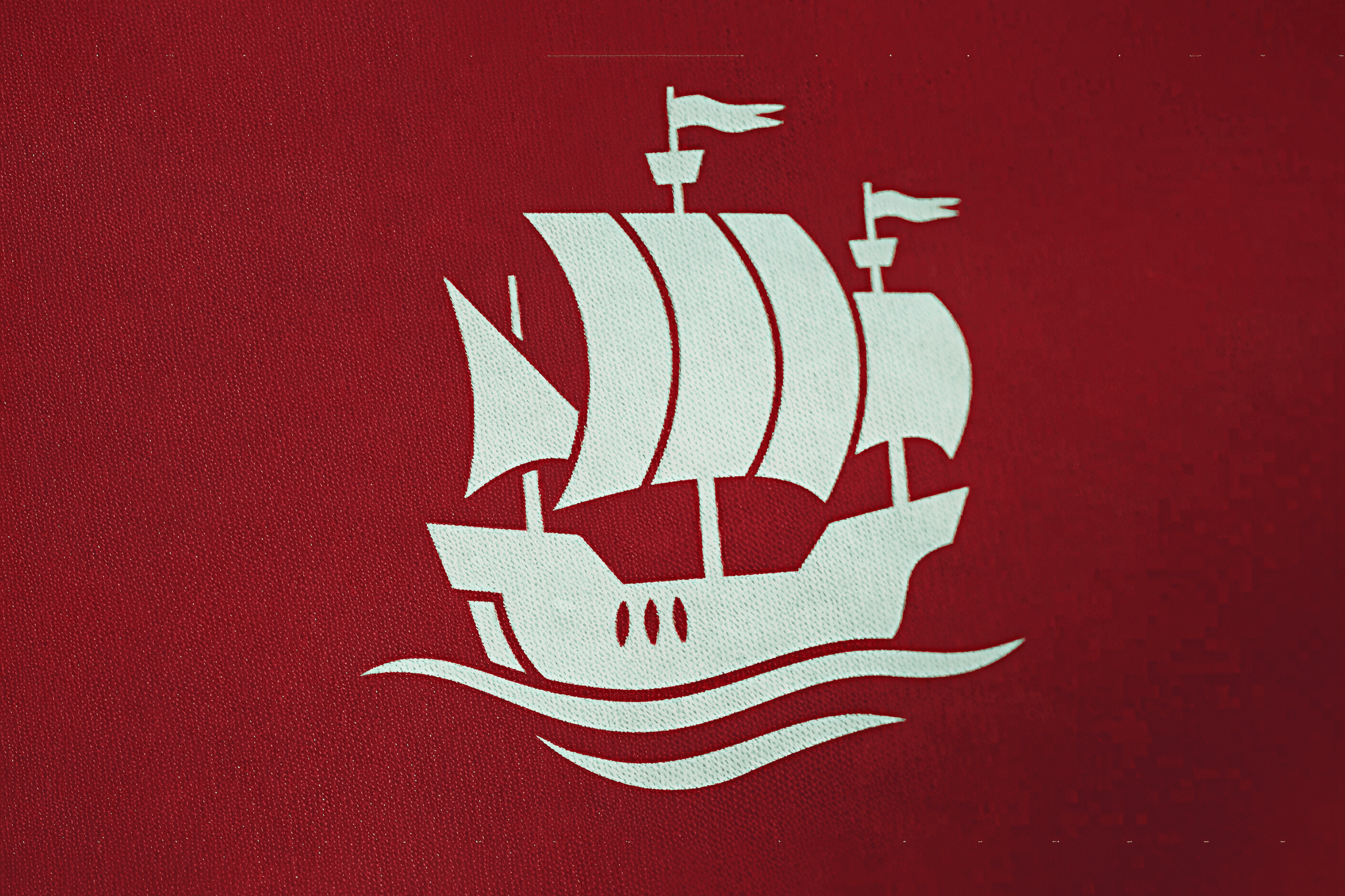 White ship icon on red background