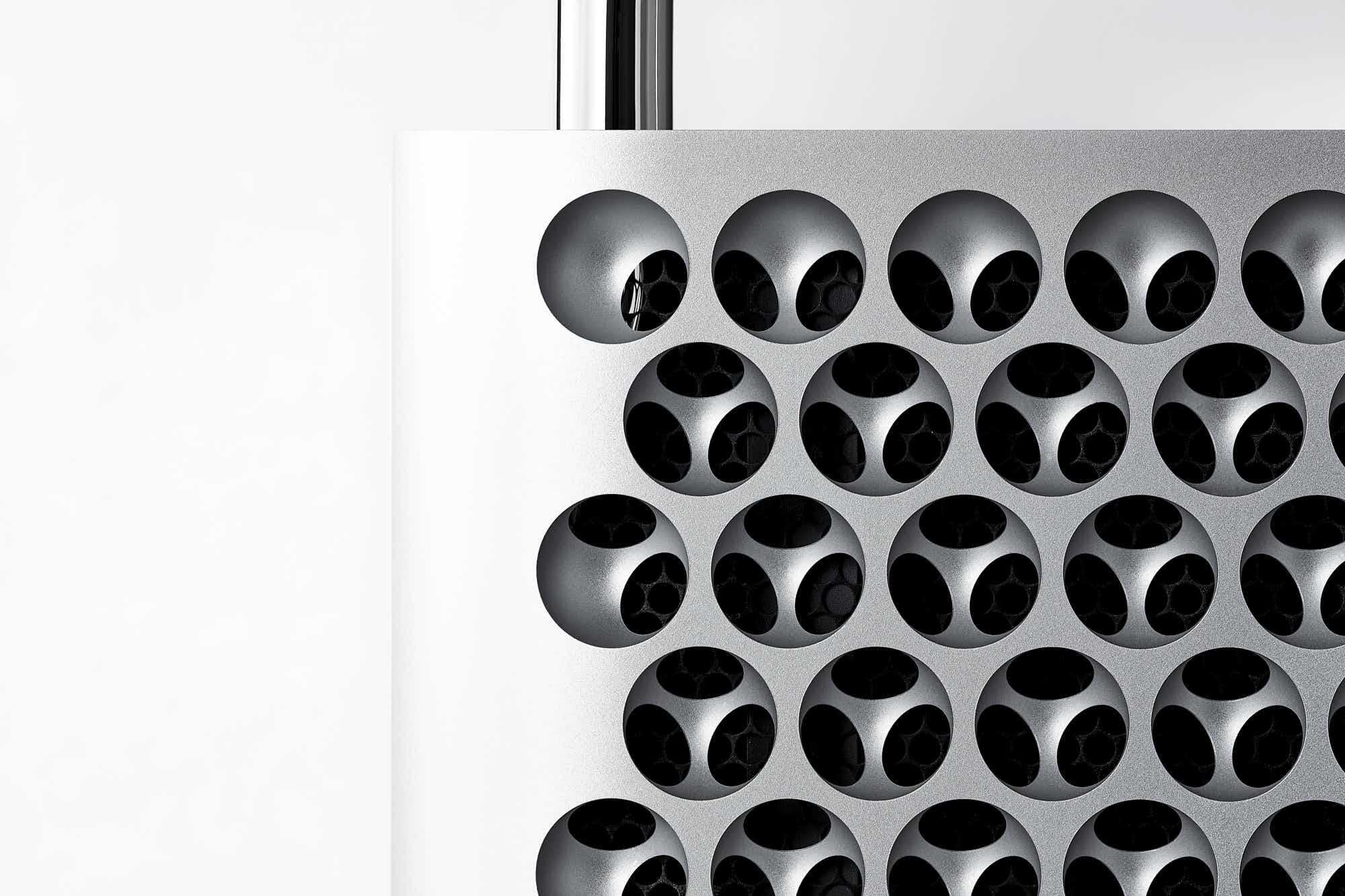 Close-up of a stylish modern computer with a unique perforated metal design.