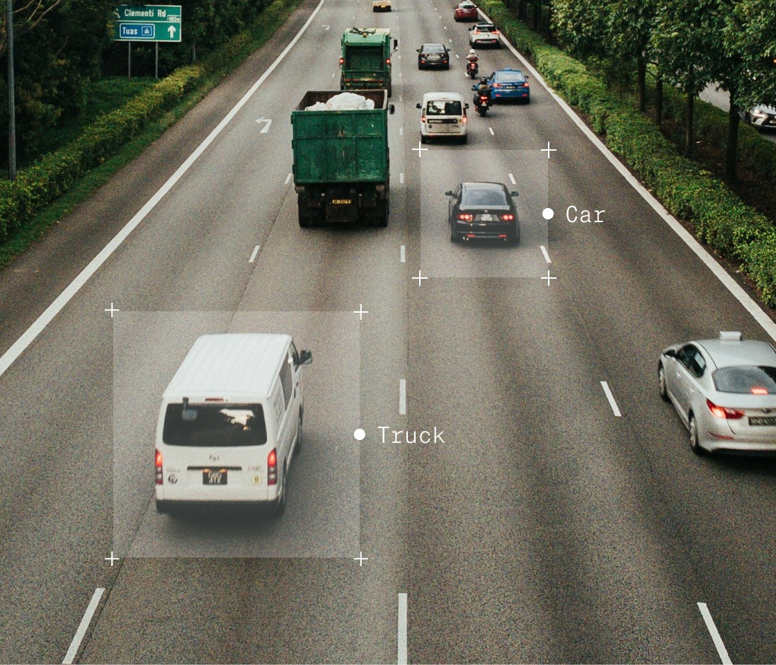 Car and truck, annotated on a busy road