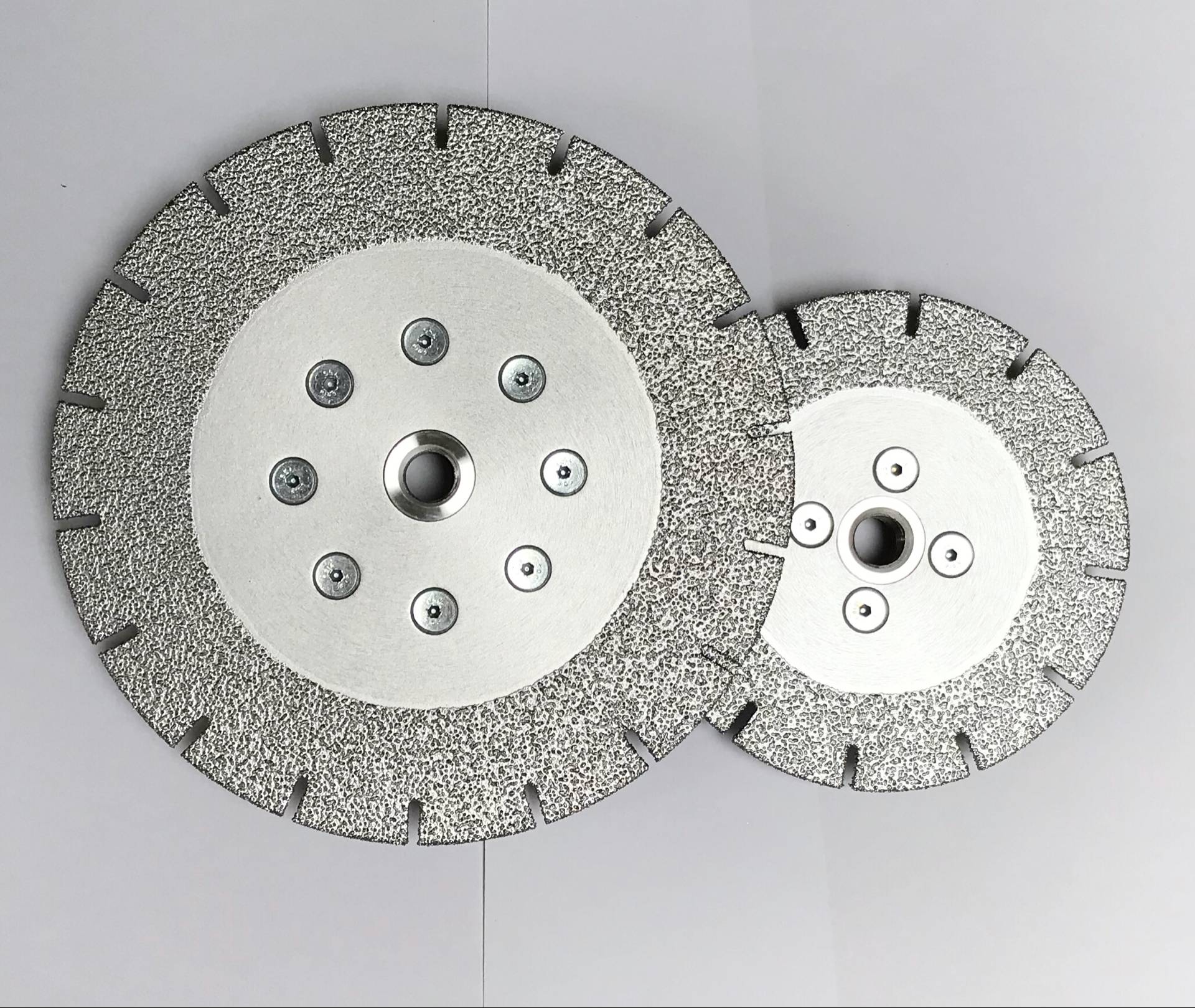 Pair of Sintered Segmented Blades of different diameters, highlighting the central mounting holes and segment design.