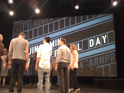 human circle formed on the stage of the ideopolis event presentation