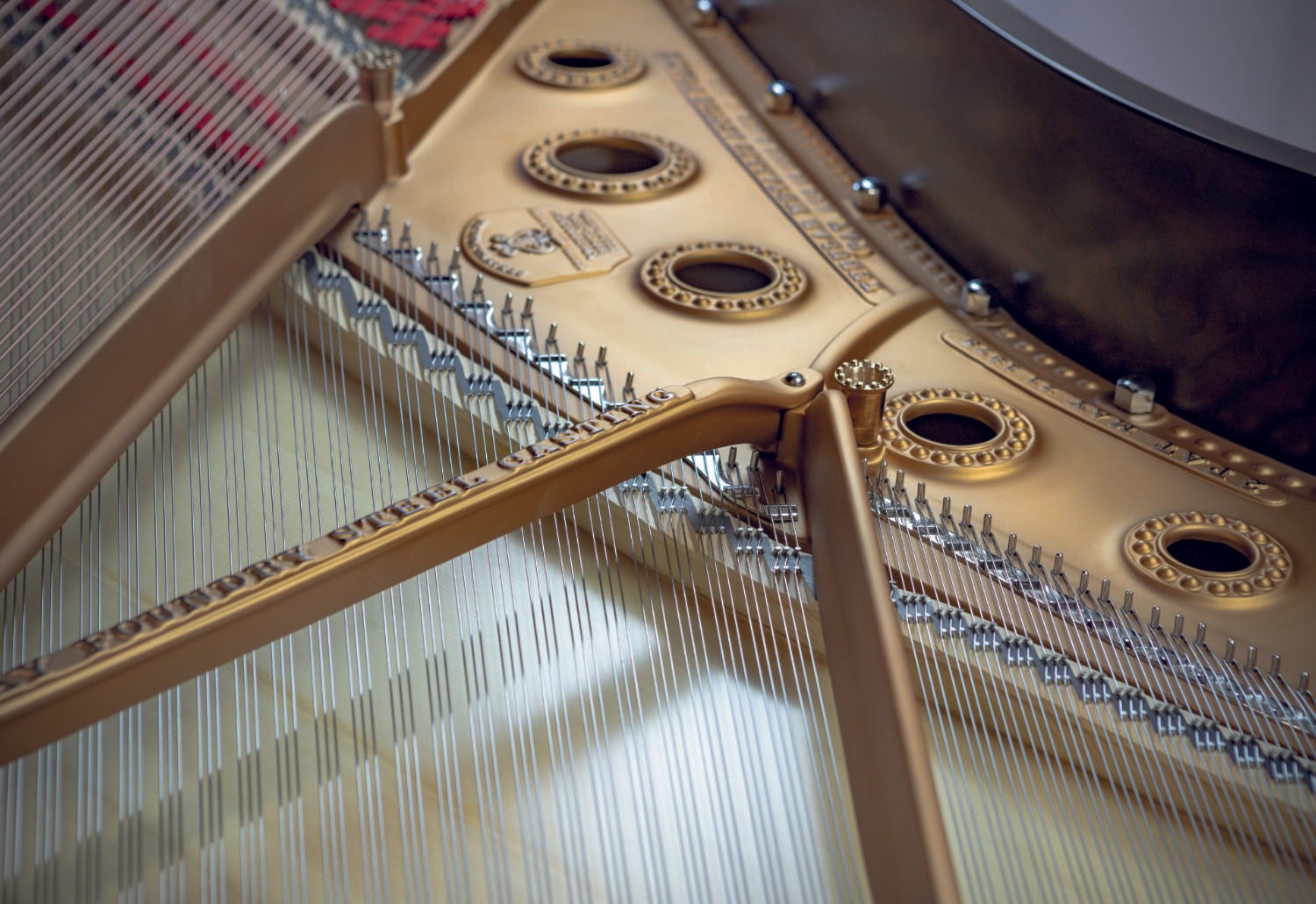 A detailed view of the piano’s interior, featuring golden hardware and a precisely restored string arrangement.