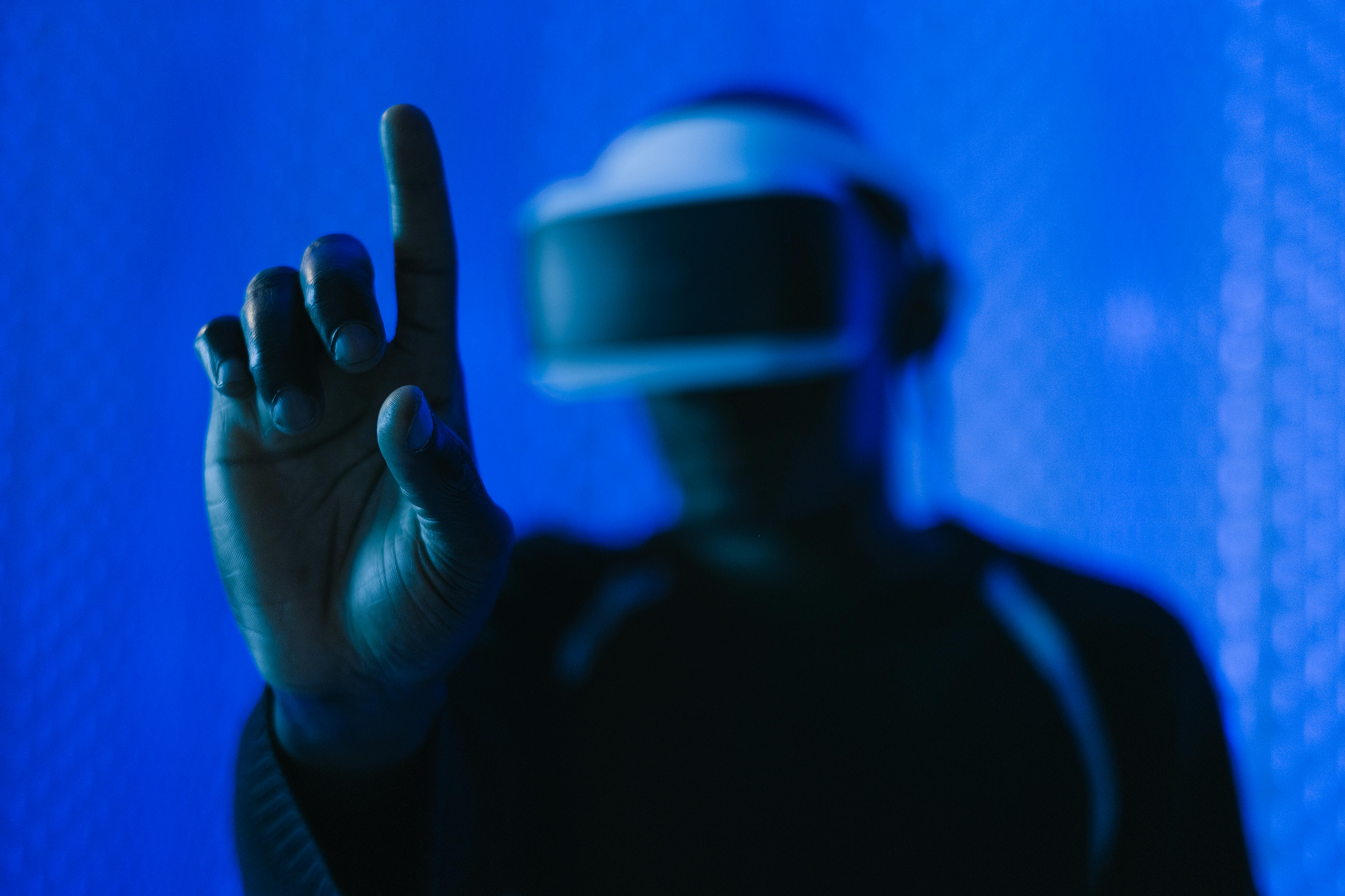 close up of man in vr glasses finger touching