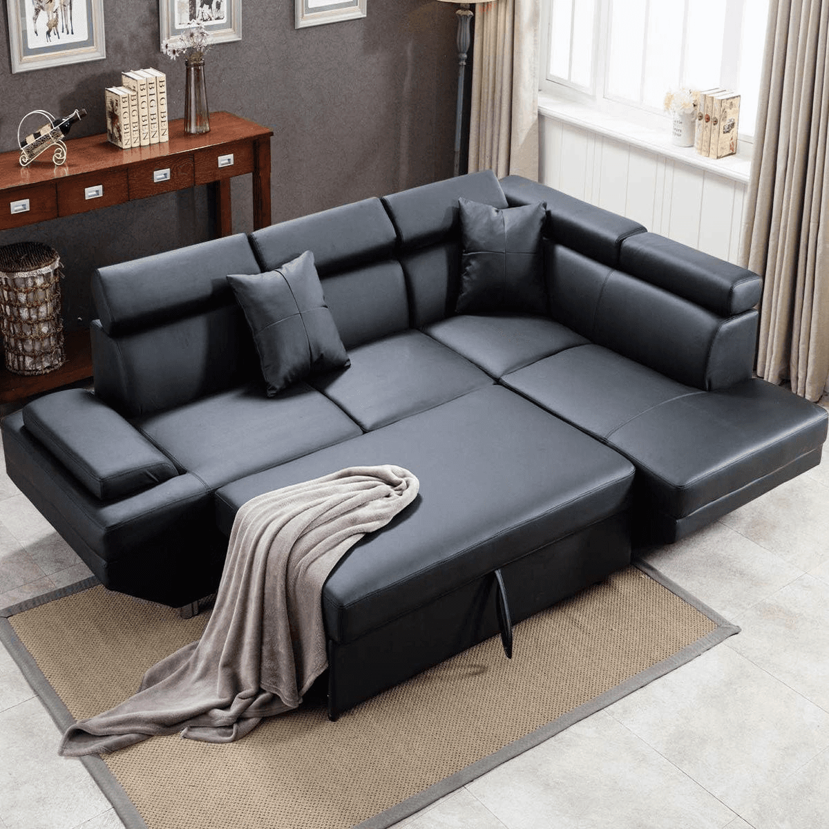 Black FDW faux leather sectional sofa with a sleeper feature in a modern living room with wooden accents