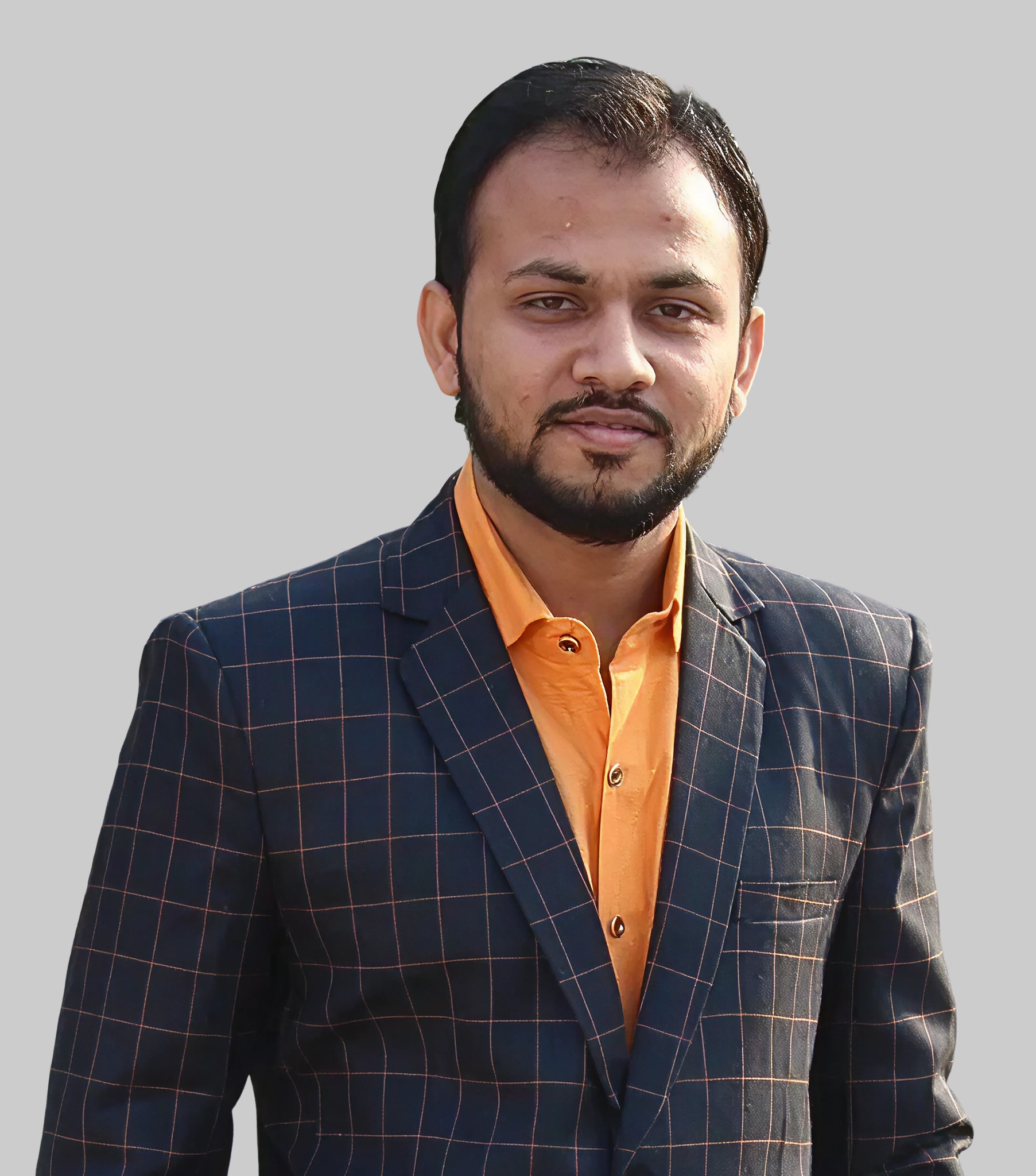 A young man in a white t-shirt stands against a light-colored background.