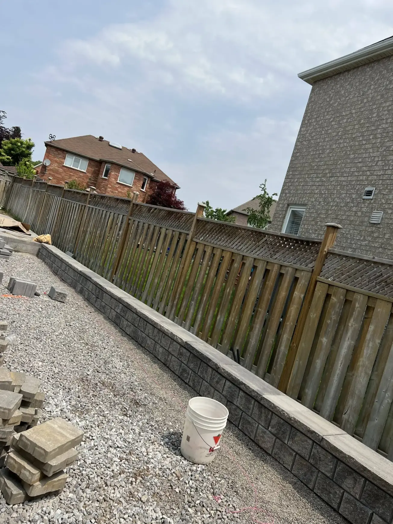 Falcons Landscaping interlocking project mid-installation with base and edging complete.