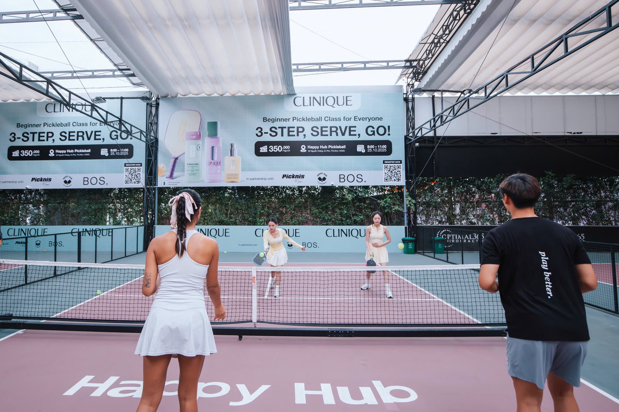 A man stading with Surfboard