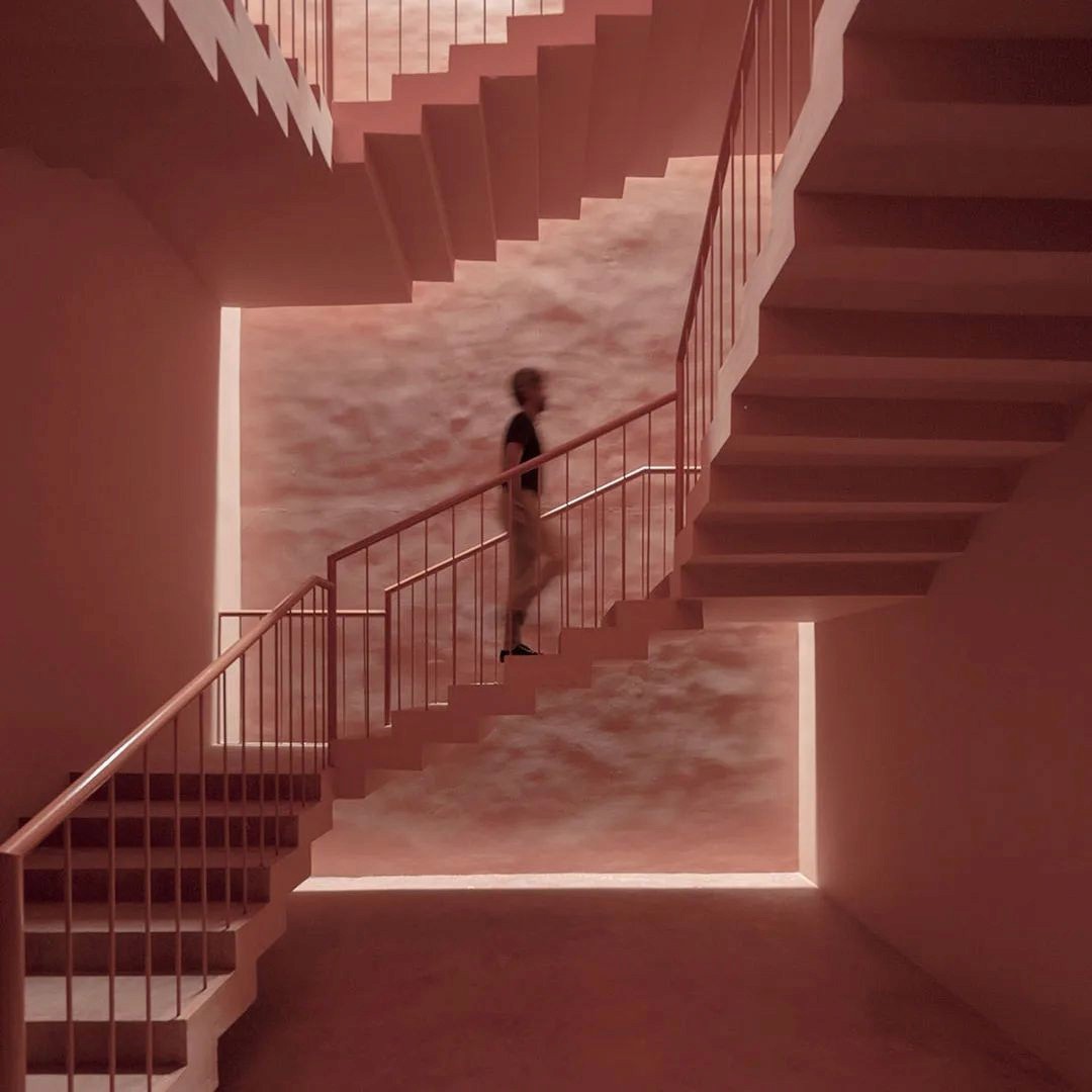 Red stairs with a man walking