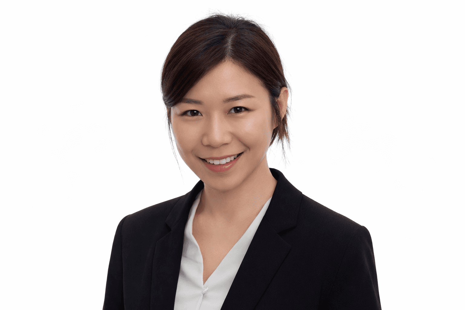 woman in black crew neck t-shirt wearing brown framed eyeglasses standing on rocky shore during