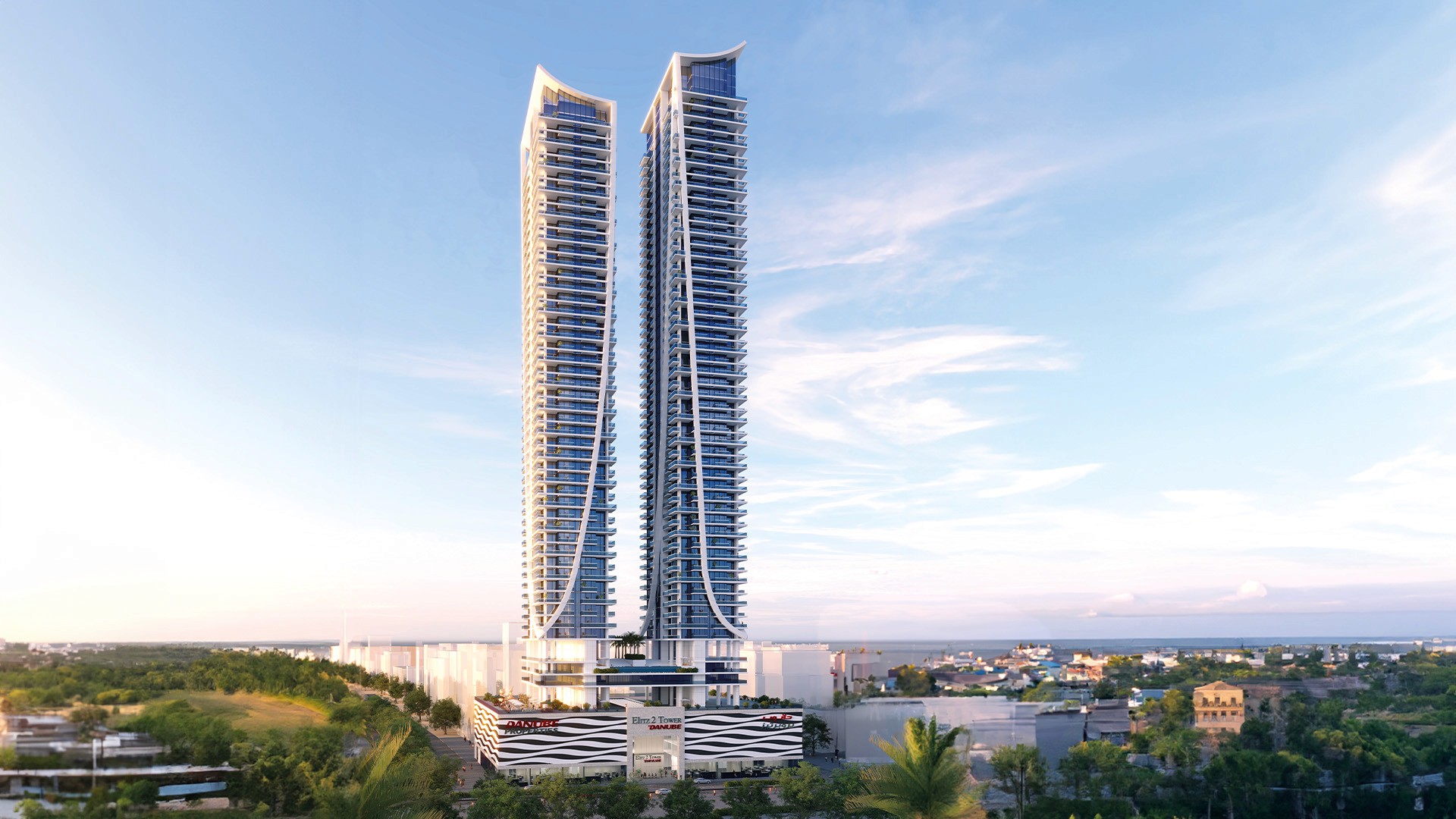 white concrete house near green tree during daytime