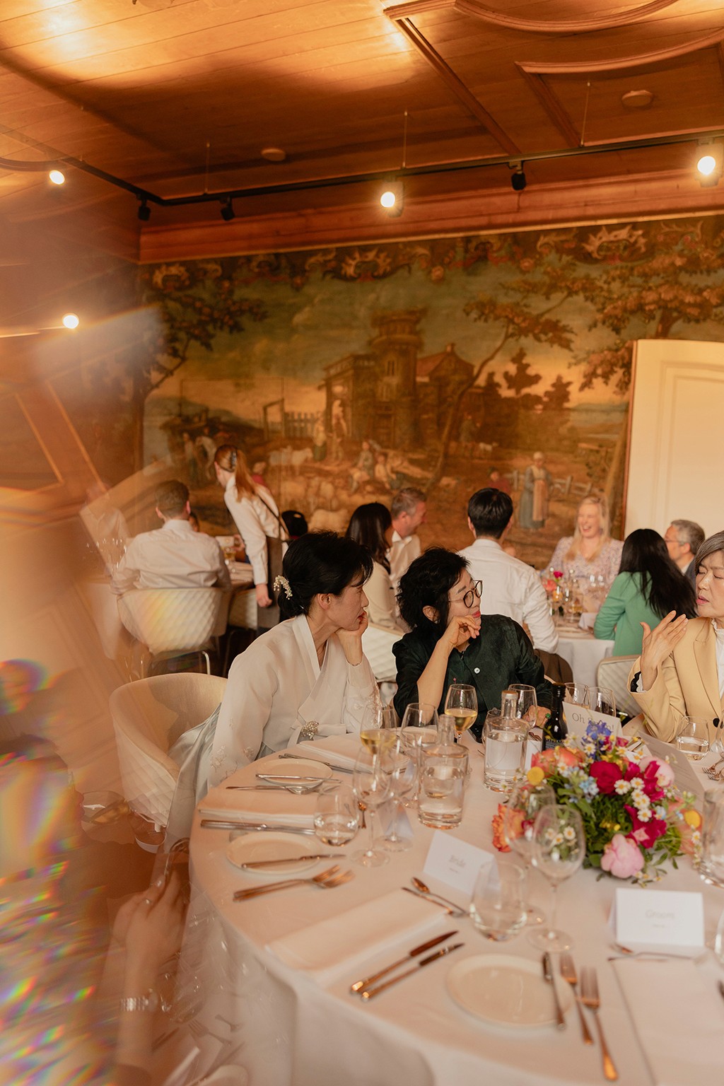 Wedding party sitting around the table and talking