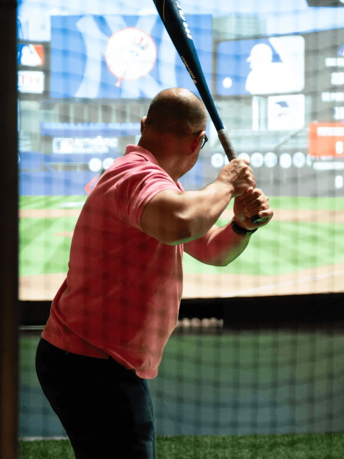 Close-up of a HitTrax game display showing virtual baseball gameplay and hit metrics.