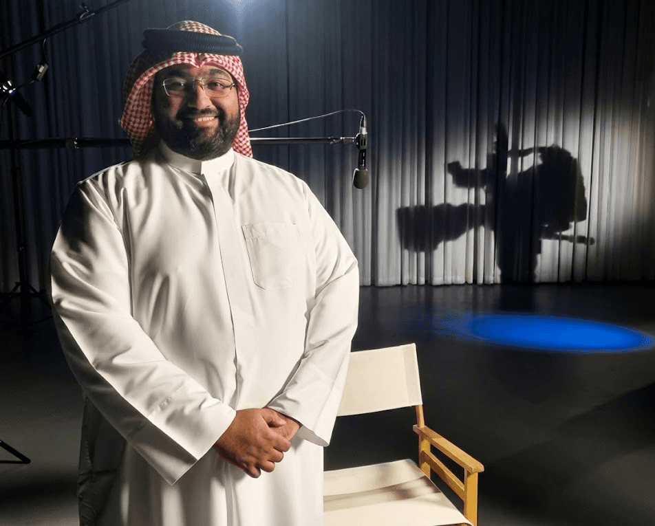 a blurry photo of a person standing in front of a wall