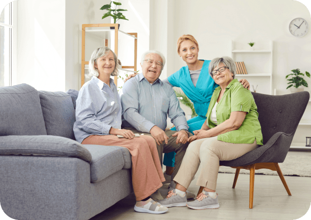 Friendly caregiver sitting with an elderly family.
