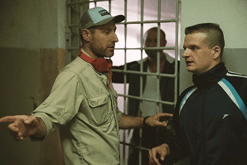 Ignas Miškinis directing Džiugas Grinys in prison scene from Southern Chronicles (Pietinia Kronikas), Oscar-nominated Lithuanian Baltic comedy film.