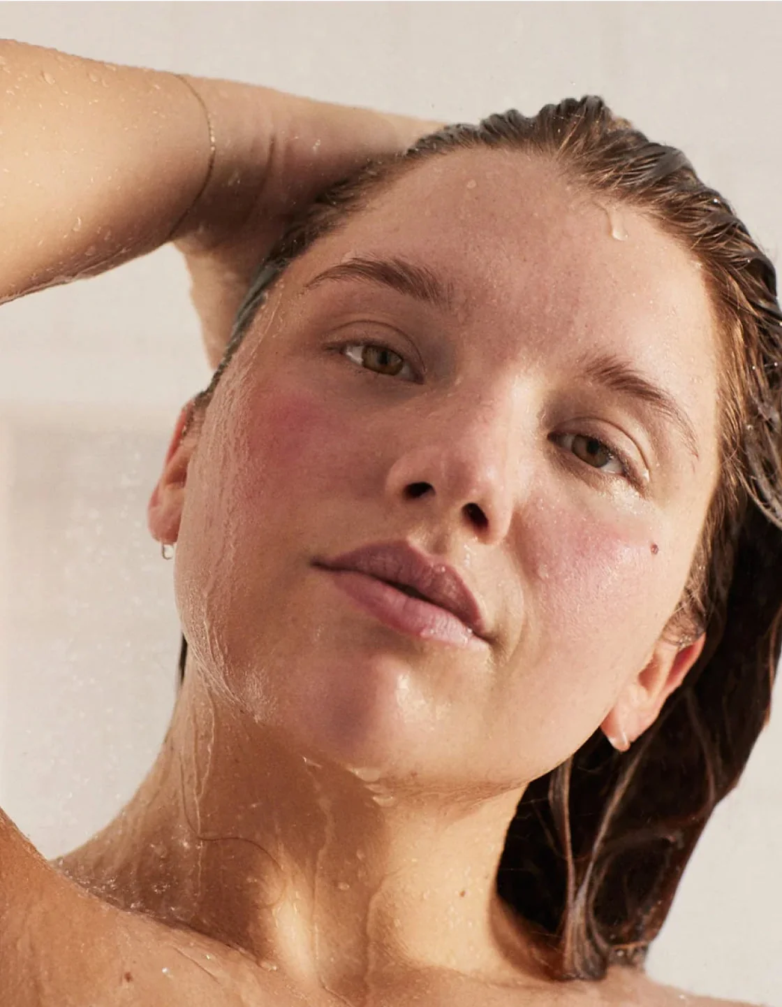 Woman using Canopy shower head